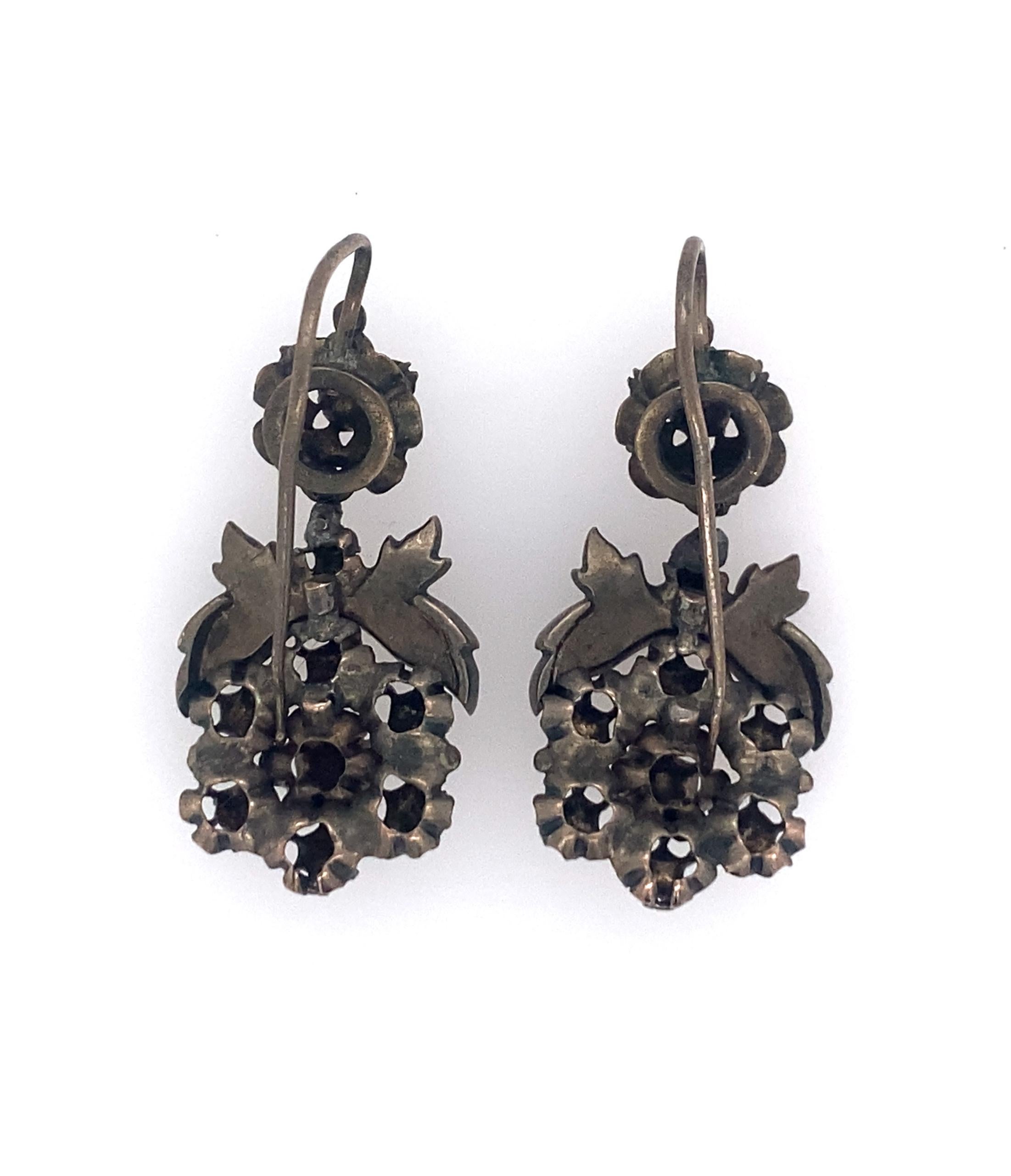 Georgian dated 1750 - 1800 Silver rose cut diamond earrings. Approx. 1 cts of diamonds. 
Weight is ap 6.4 dwts, Length including hooks is 1.44 inches.