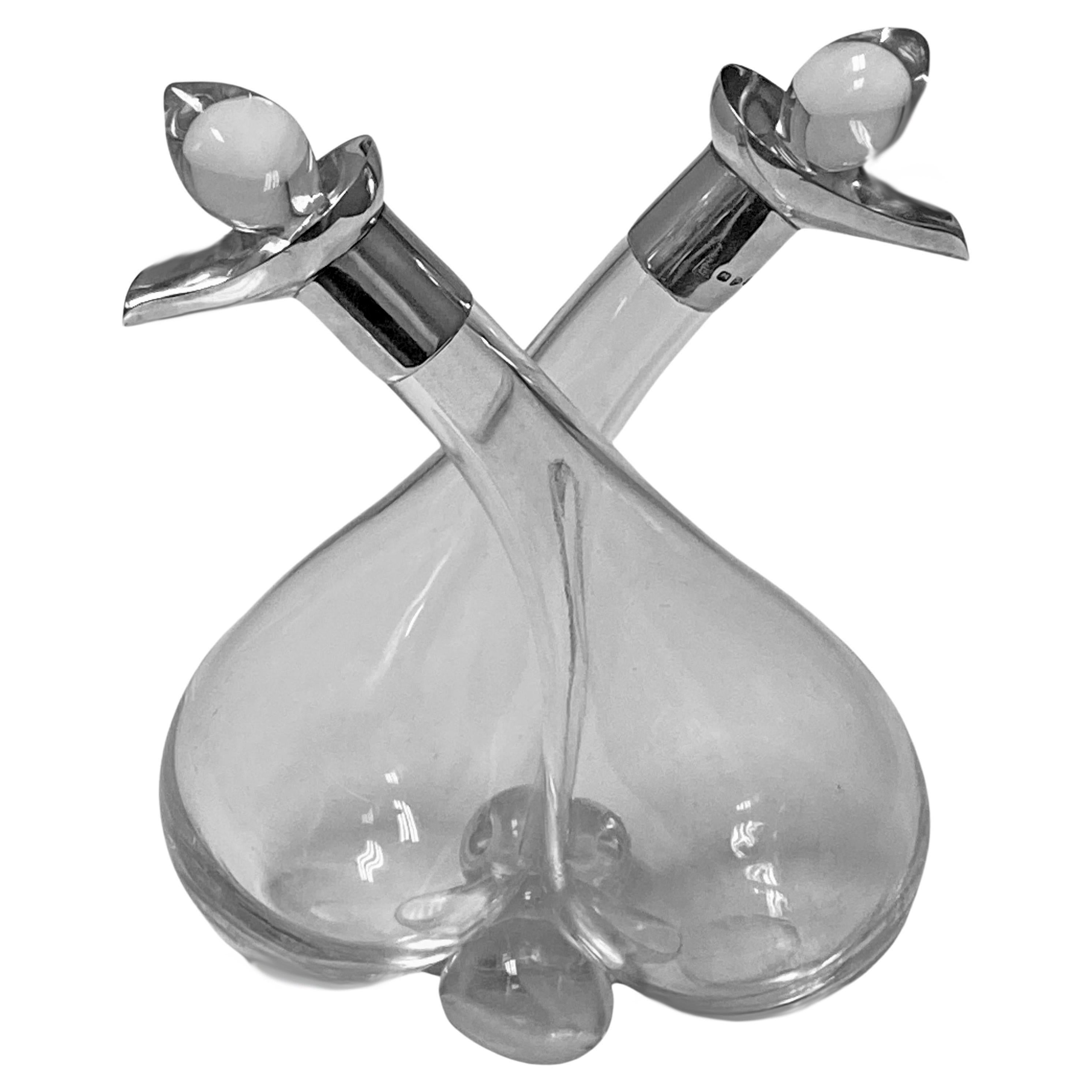Antique silver and glass oil and vinegar conjoined chester 1898 King & Sons. Conjoined clear hand blown tapered bulbous glass containers with sterling silver collar mounts, clear hallmarks, and original stoppers. Good condition. Measures