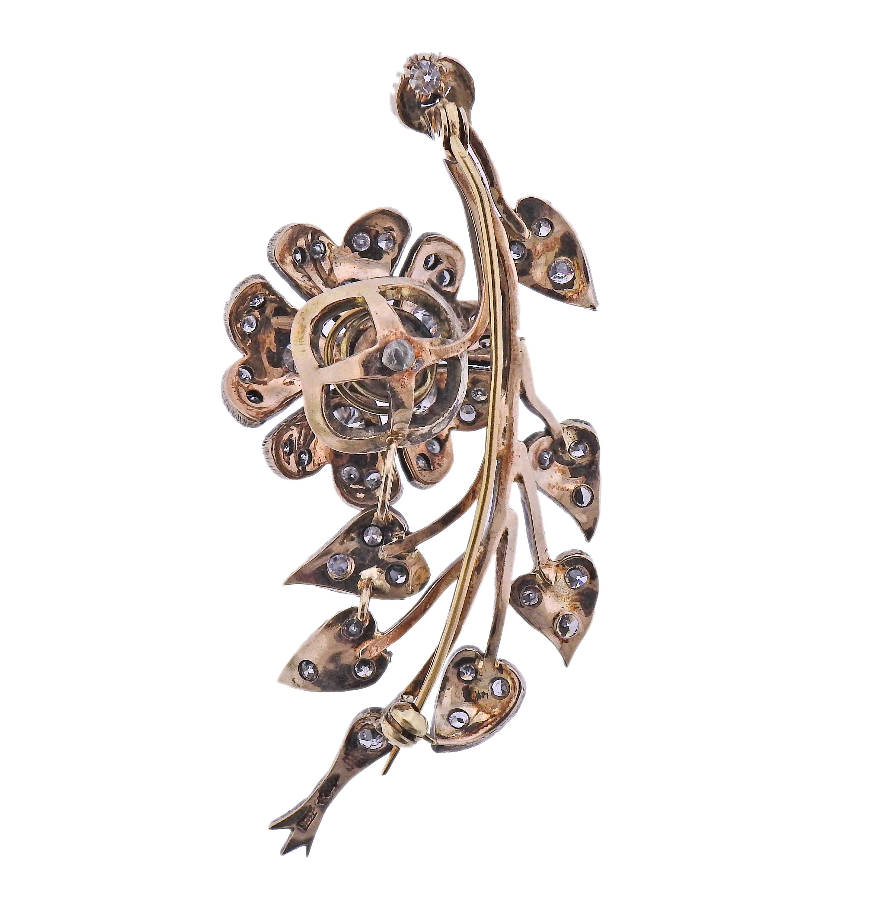 Antique 14k gold and silver flower brooch, with approx. 3.30ctw in diamonds. Brooch measures 2.75