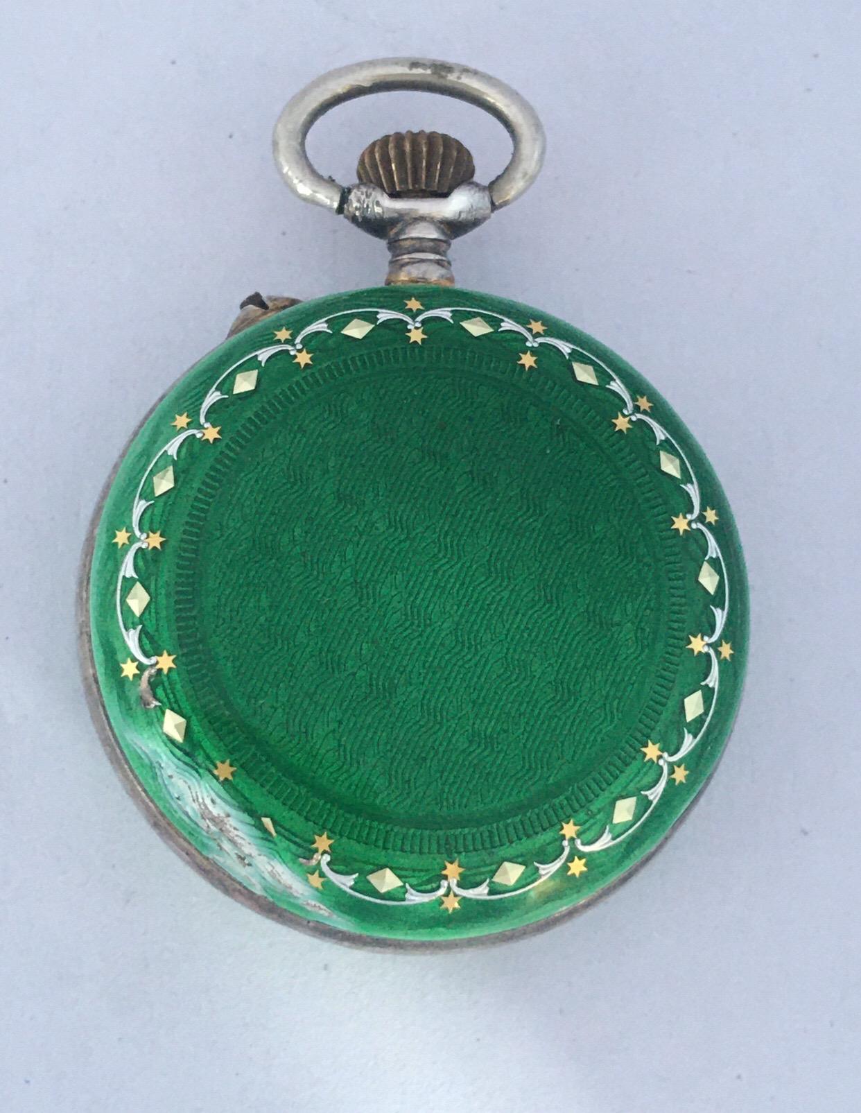 This beautiful antique 29mm diameter (excluding the crown) mechanical silver  fob watch is in good working condition and it is running well. Visible signs of ageing and wear with light surface marks on watch case as shown. Visible chip on the green