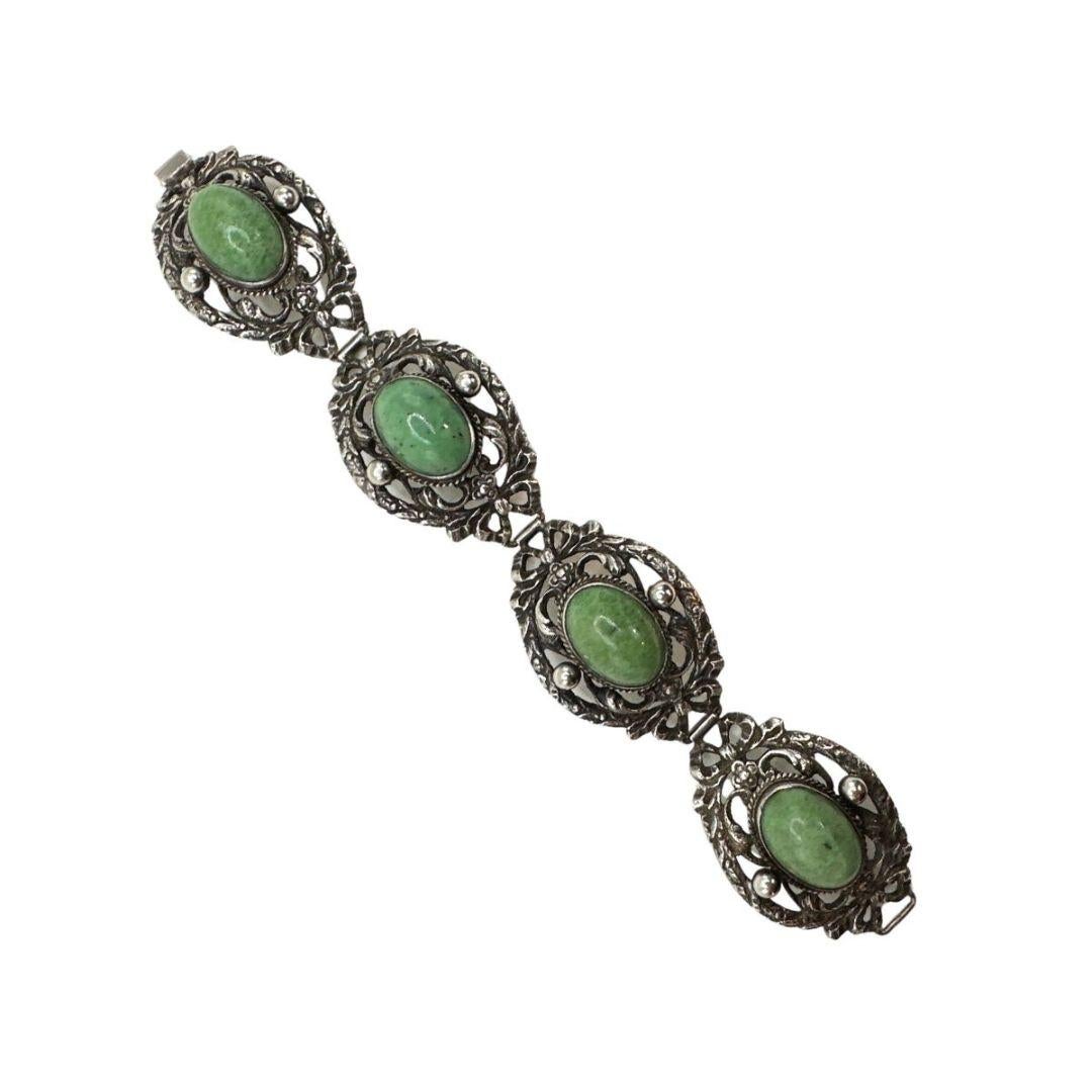 Length: 7″

Bin Code: N16 / P13

Indulge in the timeless beauty of this Cabochon Green Beautiful Antique Silver Bracelet. With its exquisite design and vintage charm, this bracelet effortlessly combines elegance with a touch of nostalgia.

The
