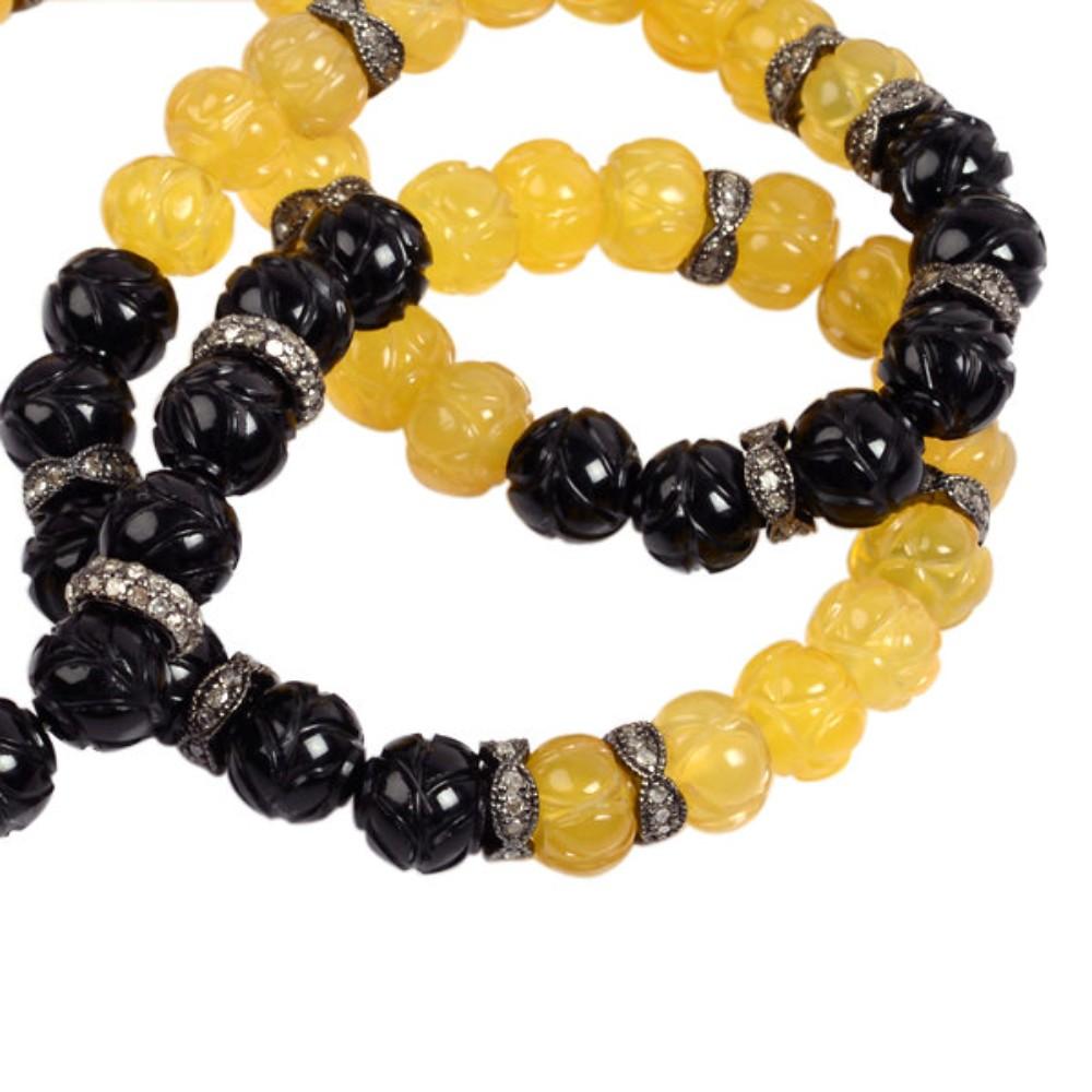 This necklace is handcrafted using high-quality beads and features sparkling diamond accents. The necklace has onyx and agate beads that add a touch of natural beauty to the piece. Onyx is known for its grounding and protective properties, while