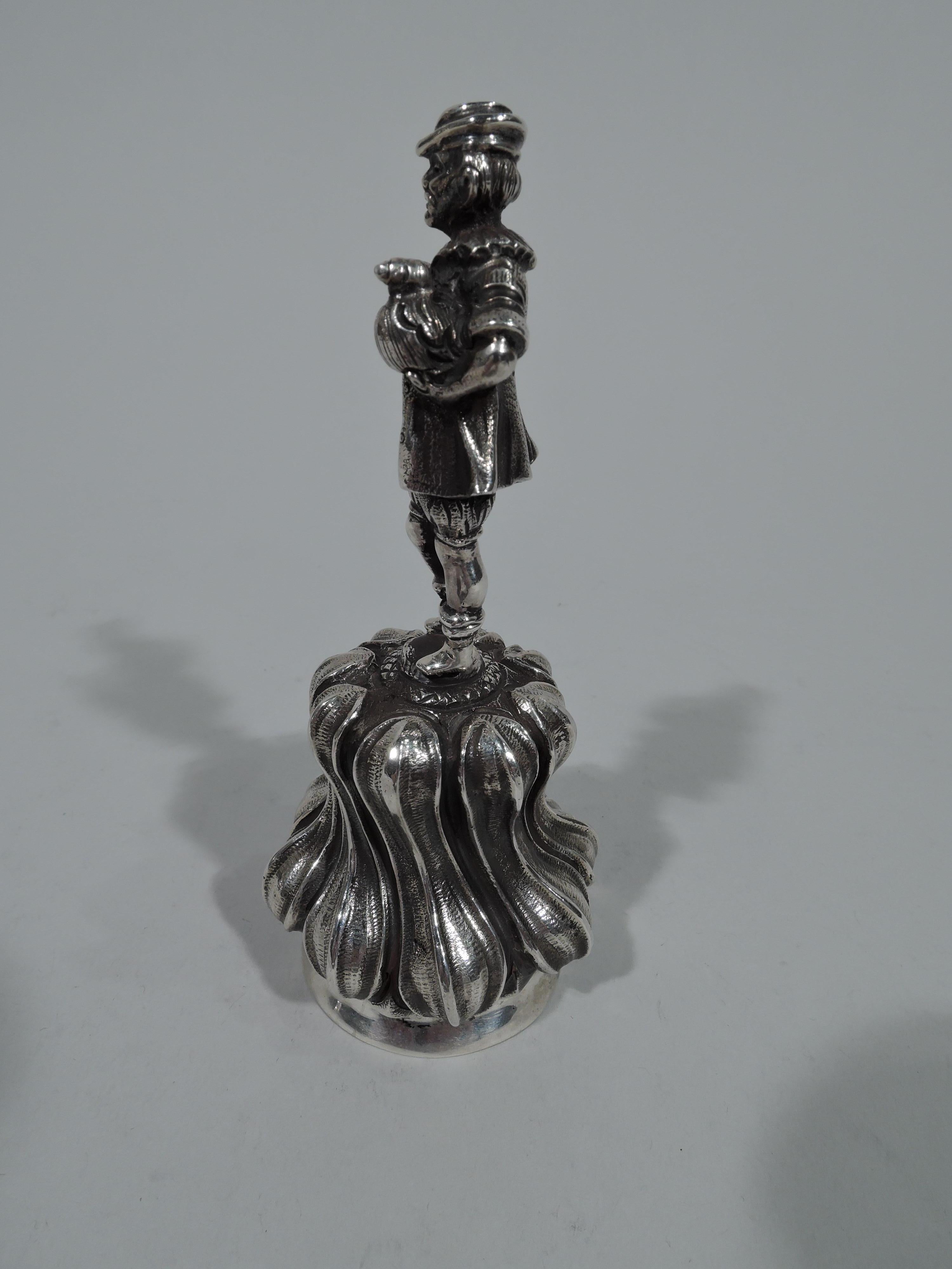 Turn-of-the-century European silver bell. Tulip-bowl with twisted gadrooning. Figural handle depicting an old-fashioned countryman holding two live fowl. Here’s dinner—eventually. Substantial and tactile with melodious ting-a-ling. Marked.  