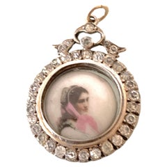 A Silver Antique Bow / Paste gem / Locket