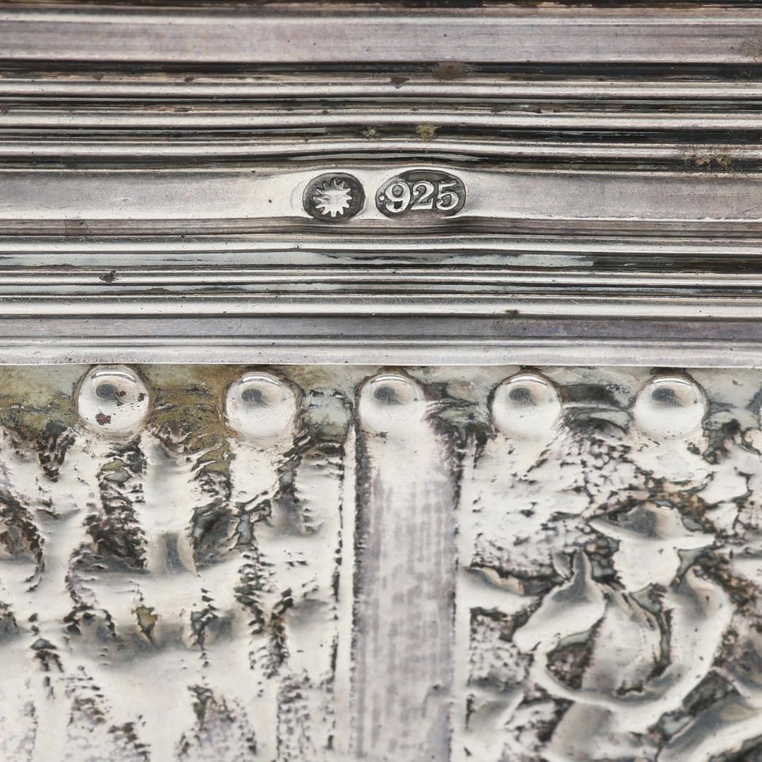 Antique valuable handmade sterling silver box or Decorative jewllery box with Illustration pressed, cast and chased. Rectangular body on short, curved feet with hinged, vaulted lid. All-encompassing C-curves in relief, latticework, rocailles,