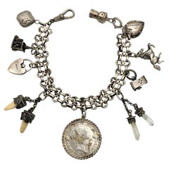 Bracciale Charm antico in argento 9 Charms Faro Cavallo Cuore Denti di Moneta