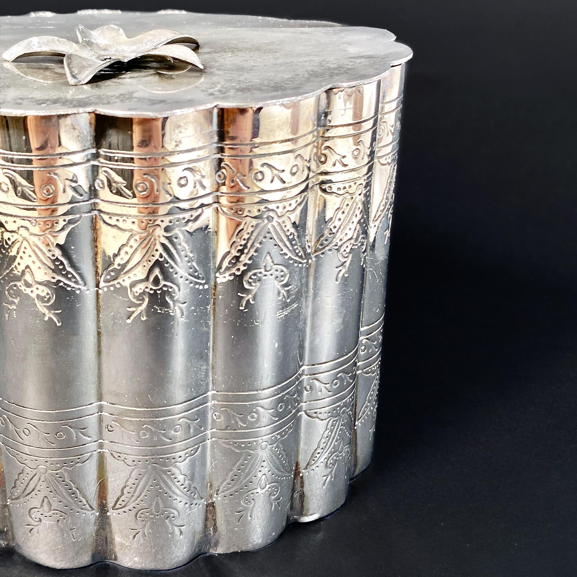 Enhance your collection with this exquisite antique silver container from the early 1910s. This elegant piece features a stunning silver box with no visible brand markings but a distinctive hallmark on the back, indicating its authenticity and