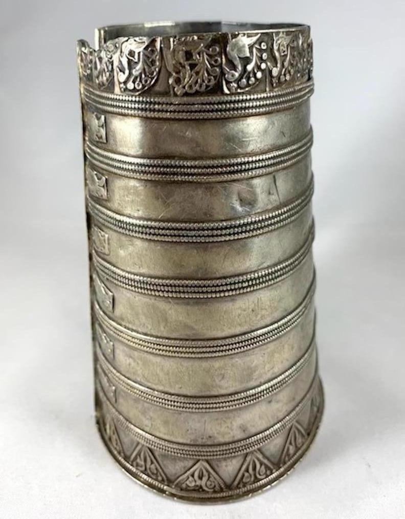 Antique Silver Cuff, Rajasthan, India

An antique silver cuff from Rajasthan (Rabari people) with a peacock motif decorating its border. It measures 9.5
