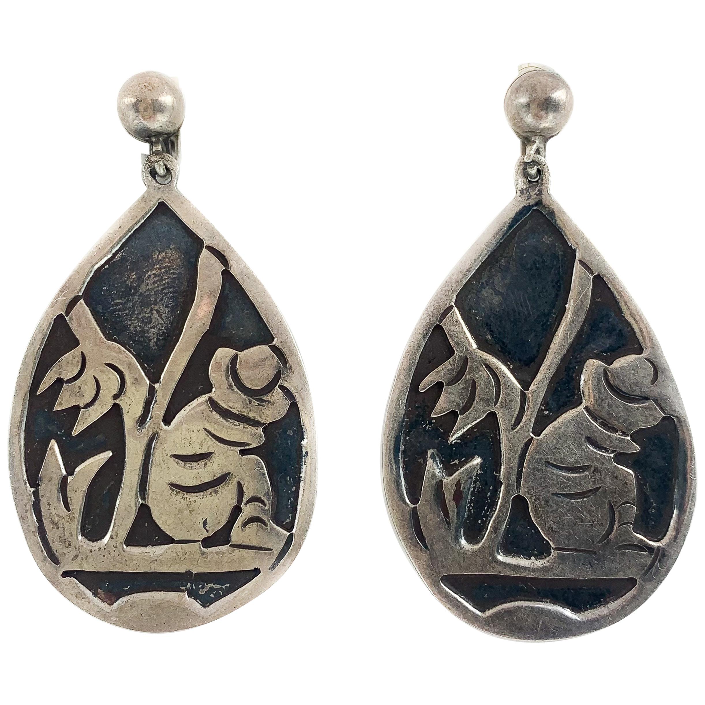 Antique Silver Dangle Earrings W/ Sitting Man Carving For Sale