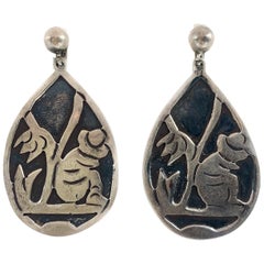 Antique Silver Dangle Earrings W/ Sitting Man Carving
