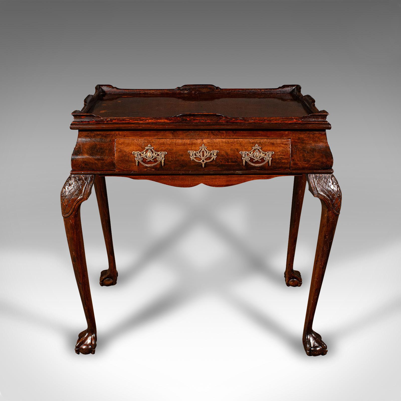This is an antique silver display table. An English, walnut table with candle slides in Georgian revival taste, dating to the late Victorian period, circa 1880.

An attractive example of Georgian revival taste with appealing features
Displays a