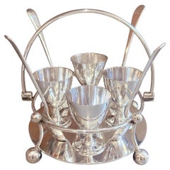 Antico supporto d'argento per uova con 4 cucchiai d'argento