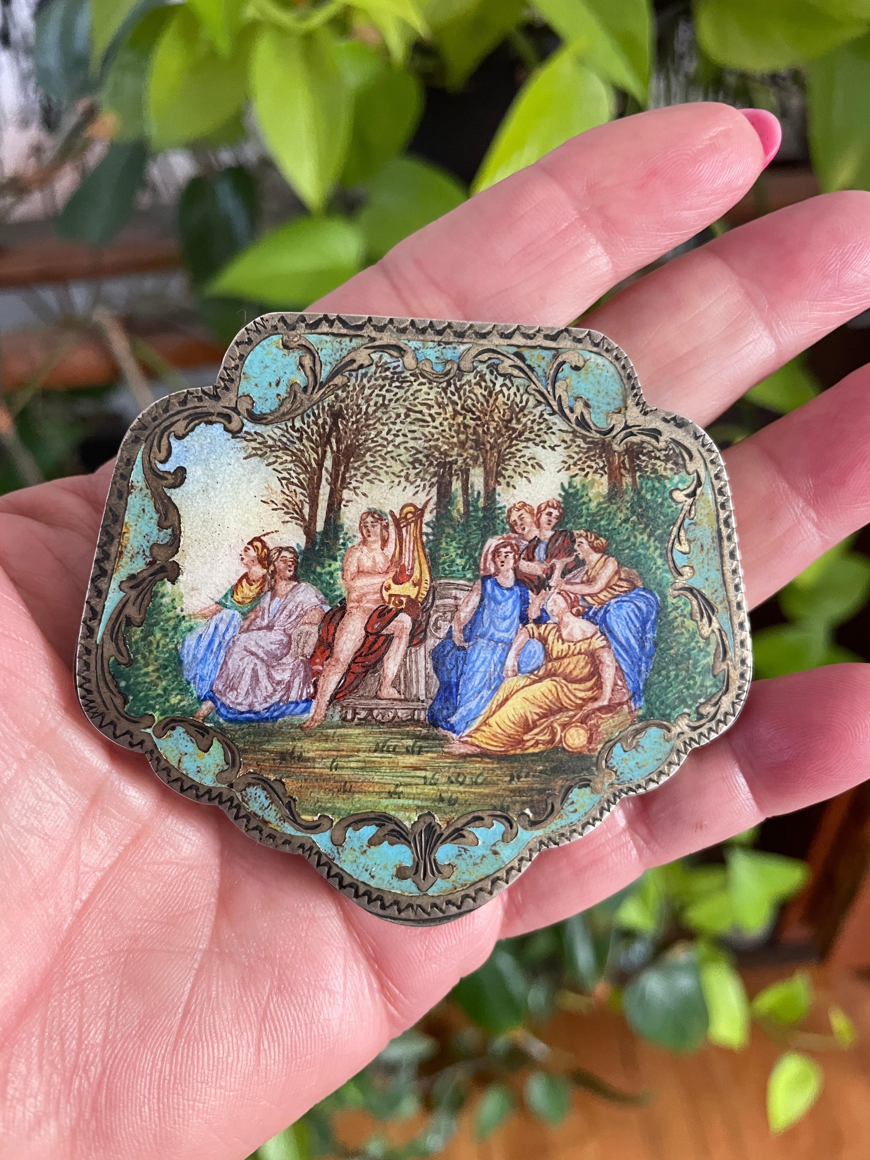 Antique Silver Enamel Figures in Garden Scene Compact .800 Silver. Miniature portrait depicting a group in a garden listening to music. A nude male playing an instrument. Measuring 3.05