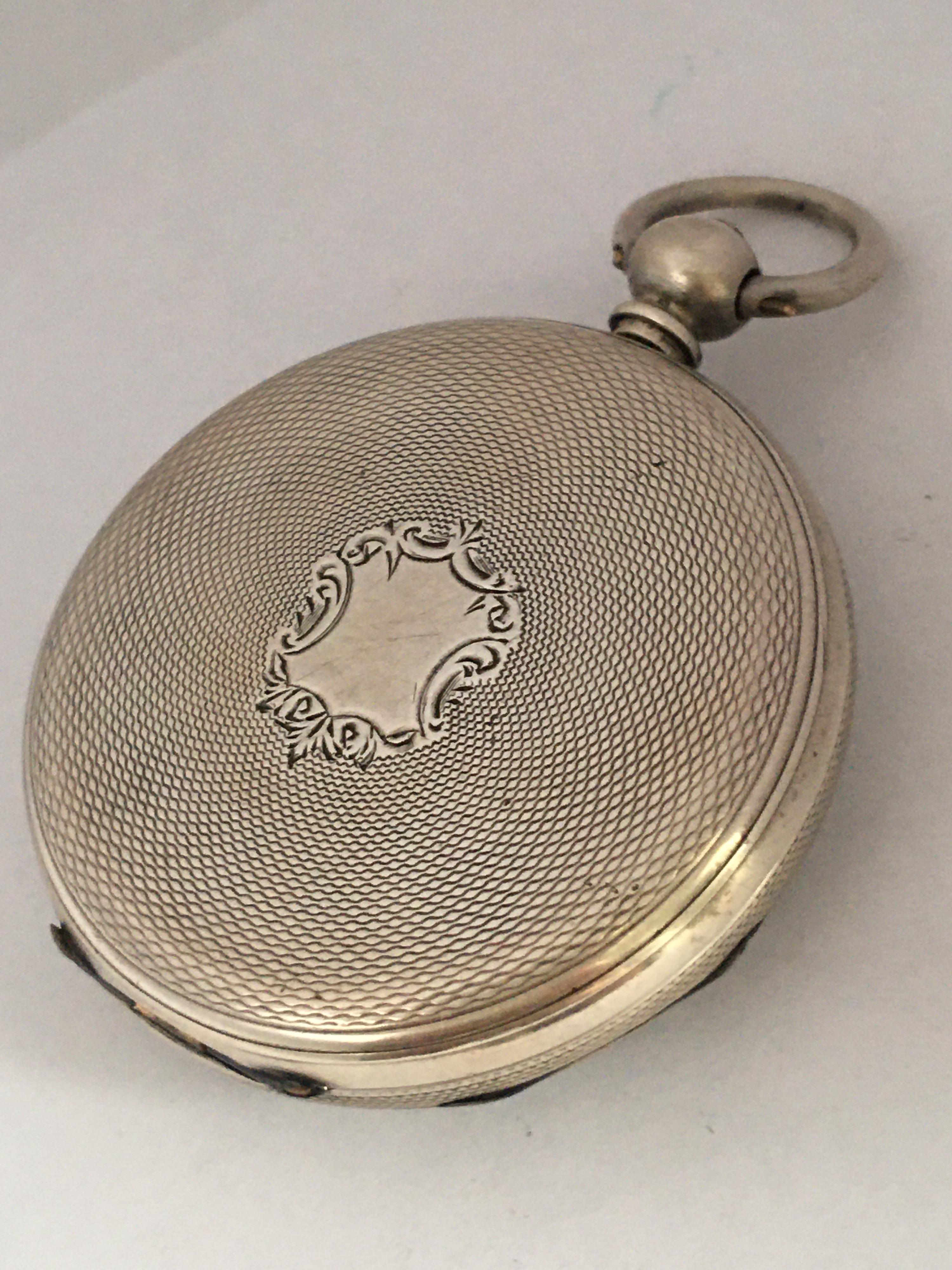 This beautiful 46mm diameter silver key-wind pocket watch is in good working condition and it is ticking and running well. Visible signs of ageing and wear with light tiny surface marks on the silver case and a bit of tarnished on  the hinges as
