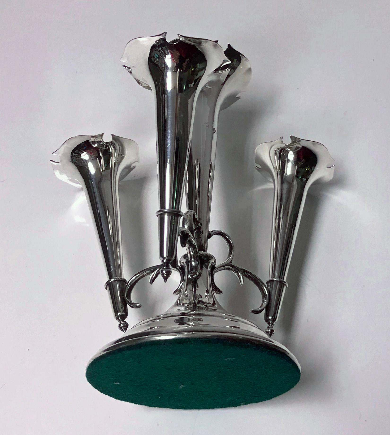 Antique Silver Epergne, Birmingham 1906, William Hutton and Sons. The epergne with four tapered trumpet vases on circular base. Measures: Height 8 inches. Gross weight: 15 oz. (loaded base).