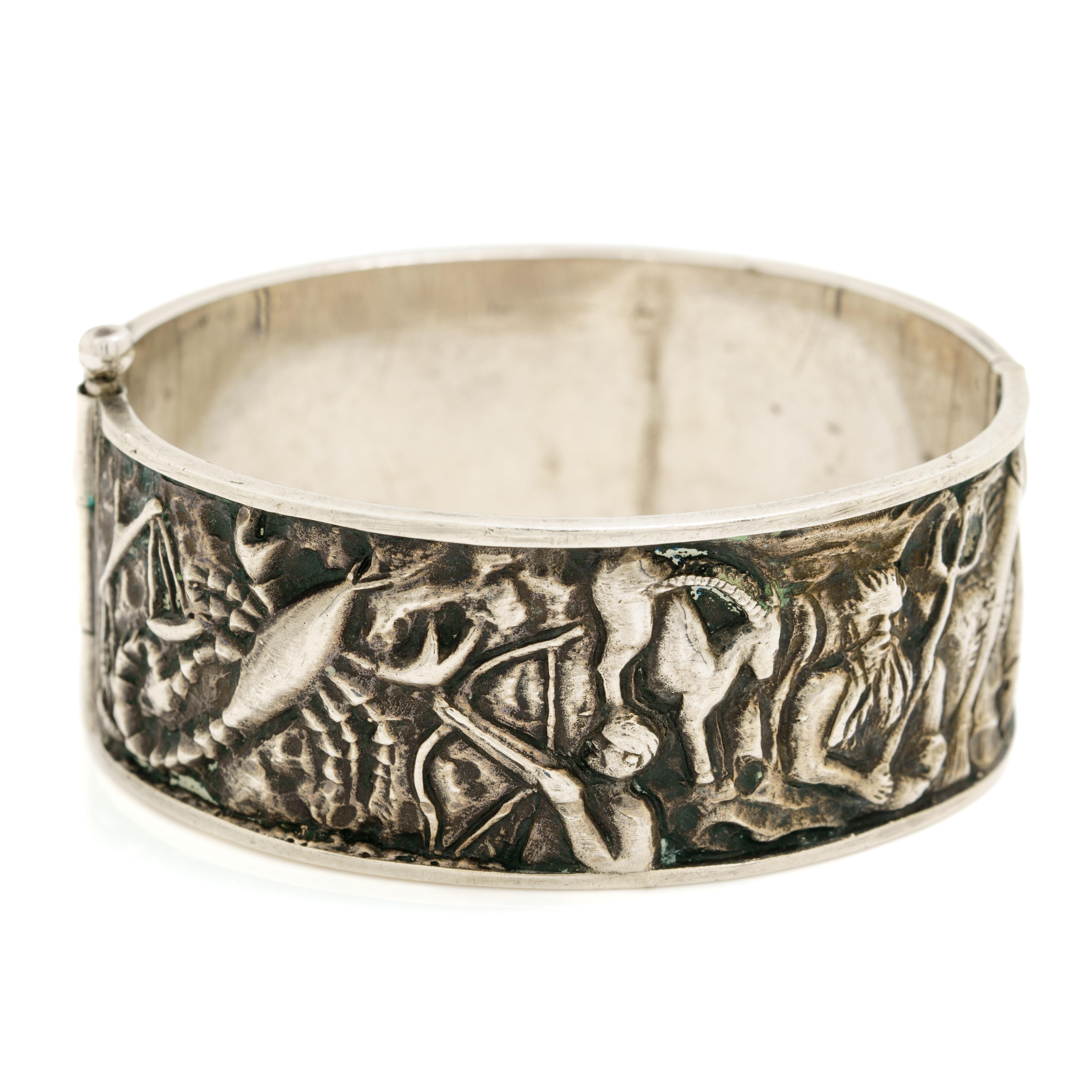 Antique Silver Etruscan Revival Astrological Zodiac Bangle
Solid, Heavy and an amazing statement bangle. Rare

81.45 grams
W: 66.75
H: 55.87
Depth:26.23

fits up to a 7.5 inch wrist.