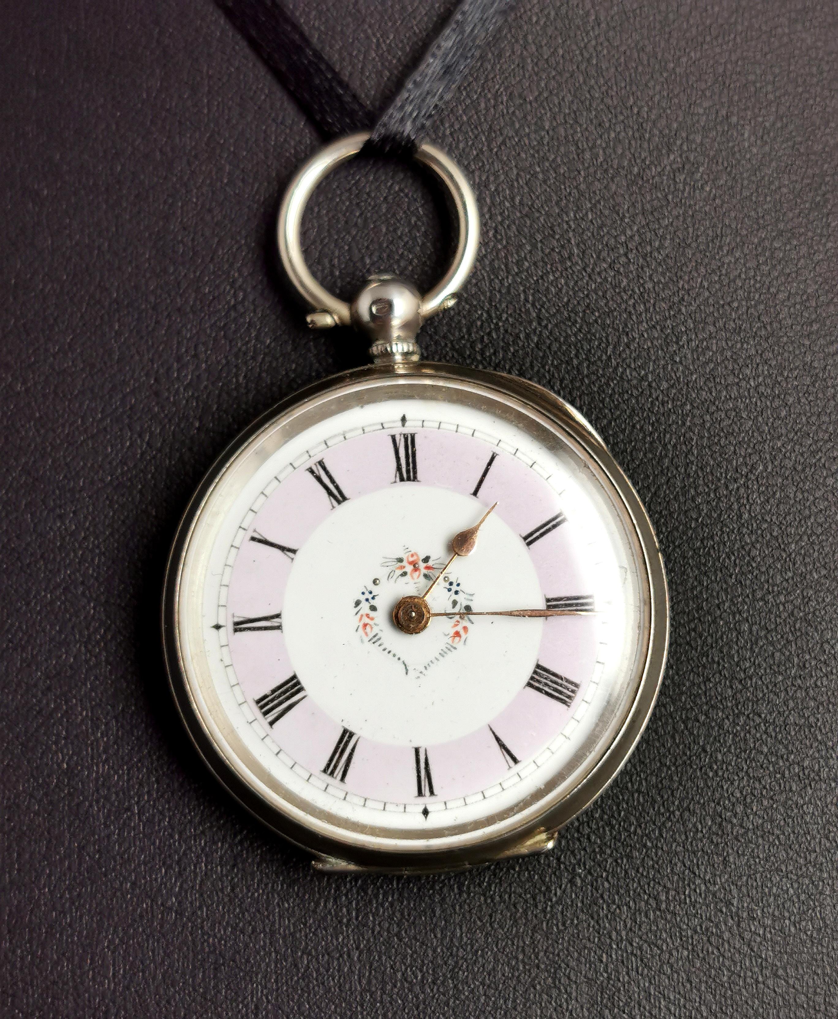 A beautiful antique, early Edwardian era silver, ladies fob watch or pocket watch.

It has a pretty silver case with an engraved floral design to the verso featuring a small blank cartouche which could be engraved if desired.

It has a white enamel