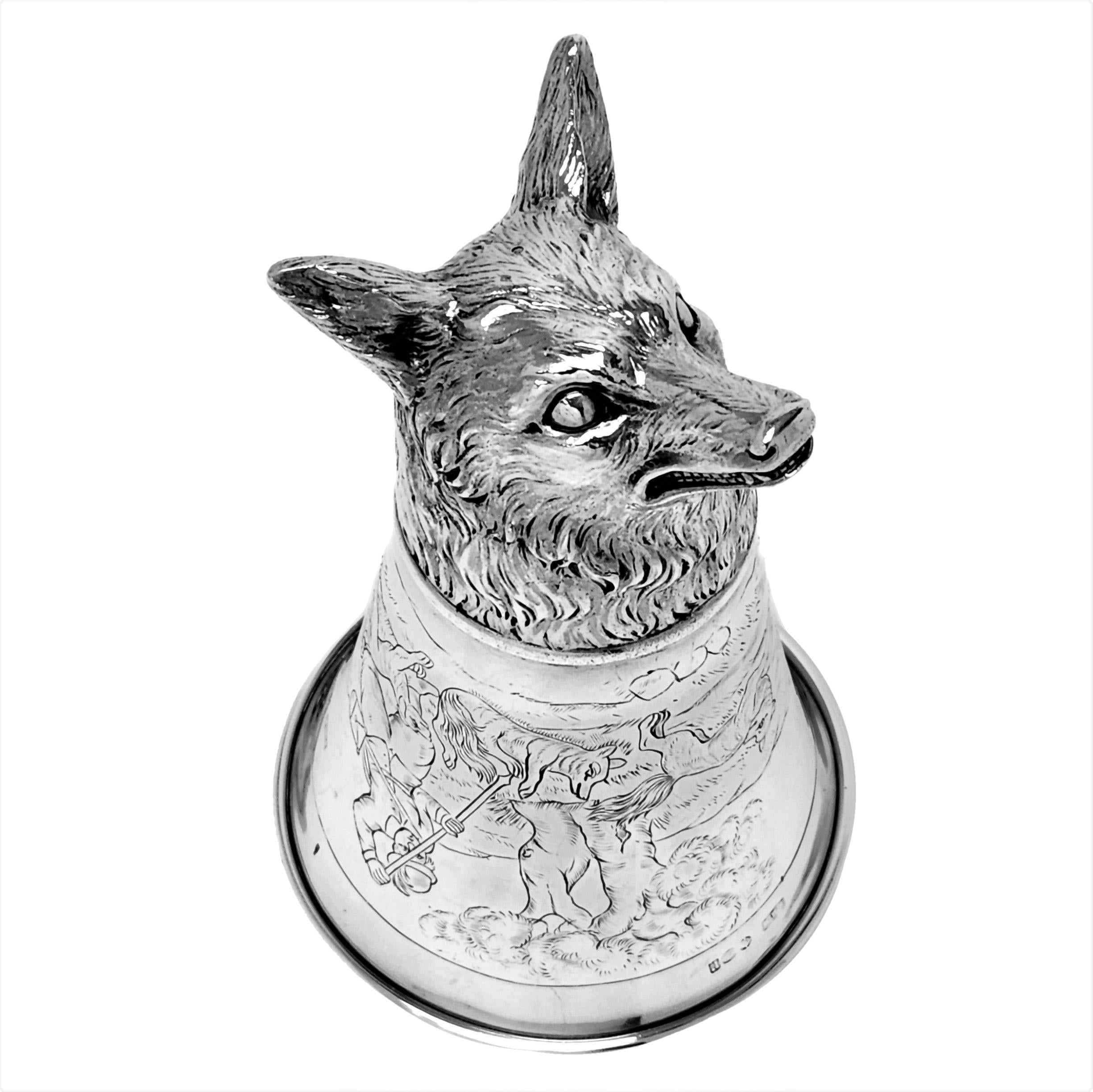 A magnificent Antique Silver Stirrup Cup with a Fox head and a fox hunting design engraved on the body. Made in the German historismus style. 

Made in Germany by Berthold Muller and imported in to England in 1912.

Measures: approx. weight -