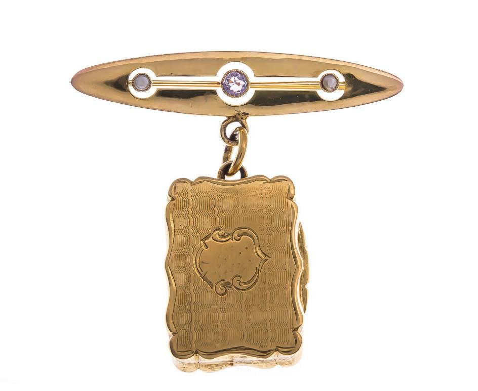 GEMMOLOGIST'S NOTES
This beautifully crafted Locket Brooch.. a gorgeous piece that's the perfect accessory for your light jacket or coat.

Designed with an amethyst and split pearl brooch, that beautifully suspends an ornate rectangular locket. A