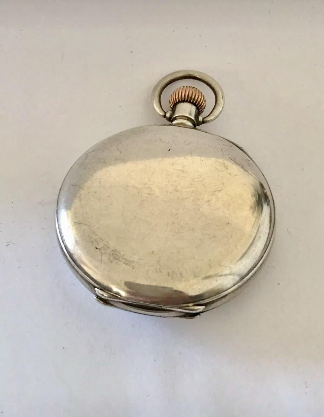 
This beautiful 54mm diameter half hunter silver keyless pocket watch is in good working condition and it is running well. A good sound heavy pocket watch. Visible signs of ageing and wear with light surface marks on the watch case as shown. Pease