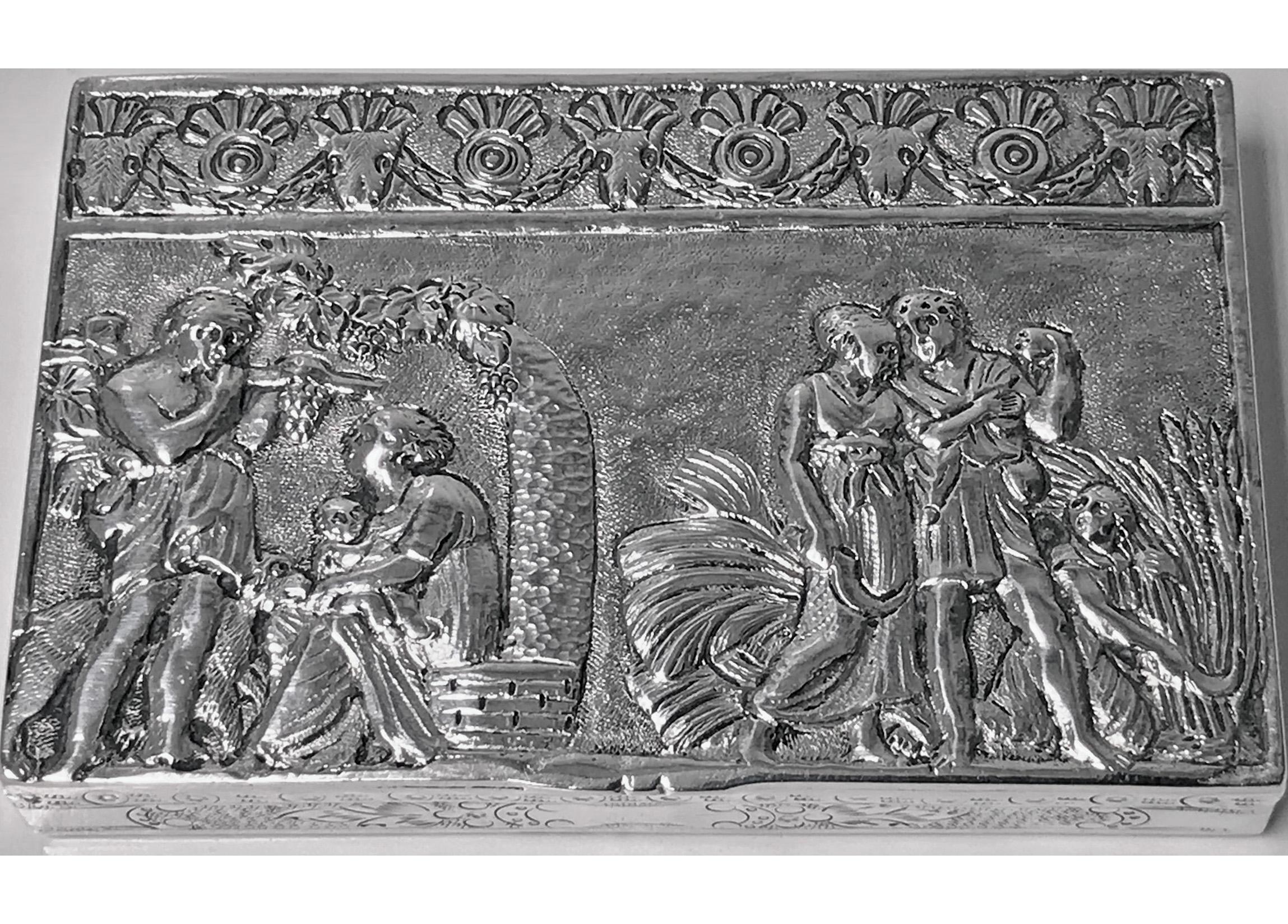Antique Silver hand chased box, Continental circa 1900. The box of rectangular shape, the hinged cover with raised decorative depictions of men, women, children and animals in landscape scenes against stippled background; the sides with engraved