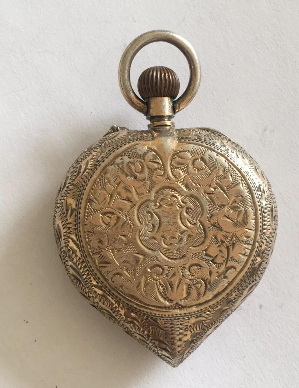This beautiful antique silver heart shaped case and enamel dial pocket watch is in good working order.