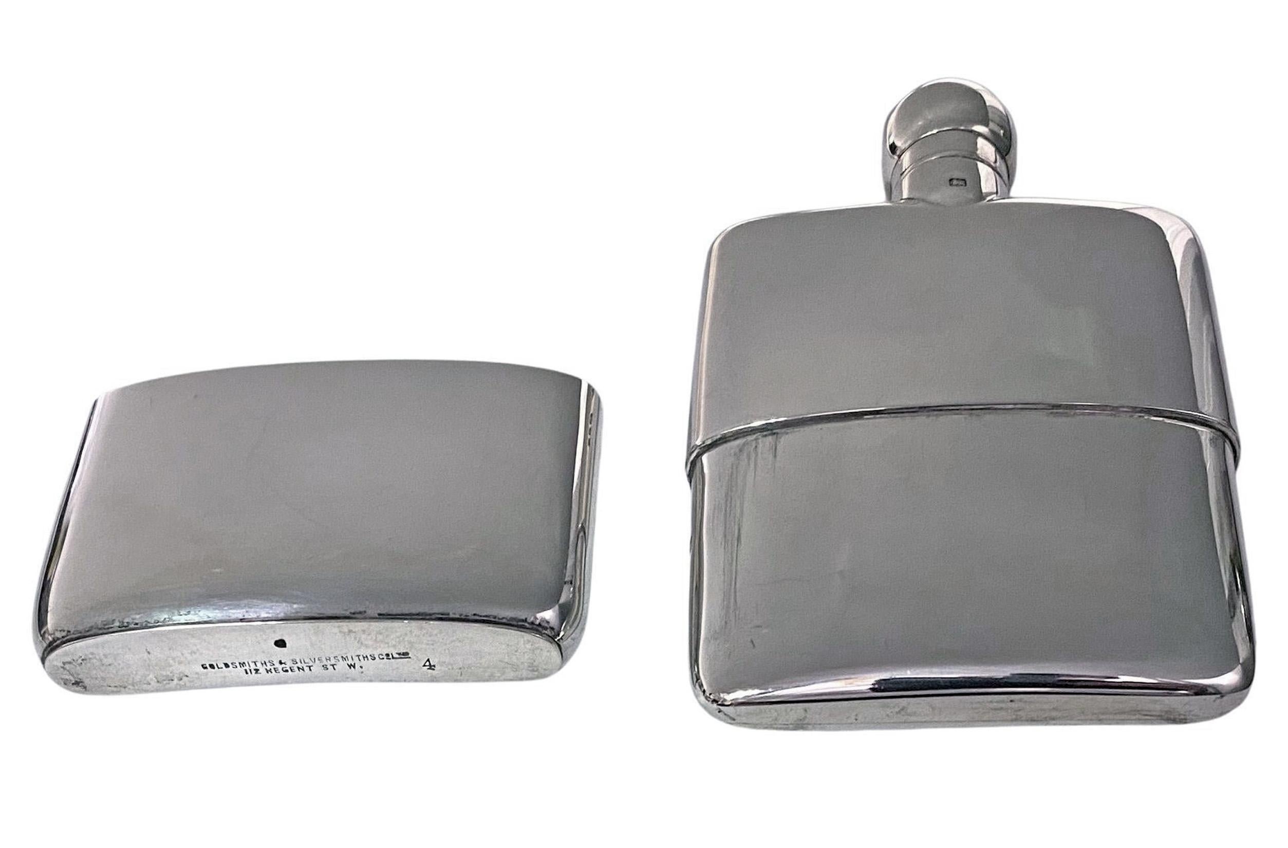 Antique English hallmarked sterling silver flask, London 1925 Goldsmiths and Silversmiths Co. The flask of plain convex form with detachable pull off drinking Cup, light gilded interior, screw bayonet top. Fully hallmarked. Measures: 5.00 x 3.00