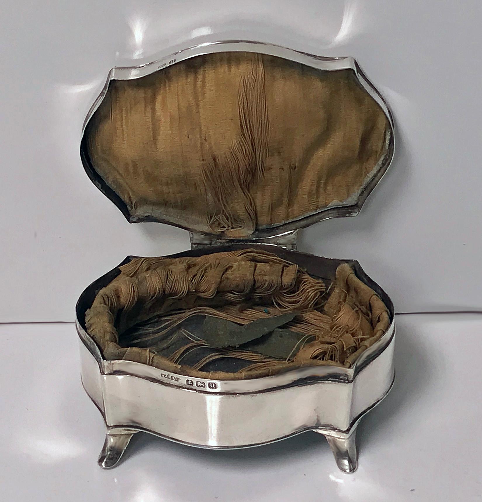 Antique silver Jewelry Trinket Box, Birmingham 1919, Hassett and Harper Ltd. The box in the form of a commode, engine turned hinged lid engraved Doris, with original gold satin interior, now distressed, curvilinear panel surround, on four turned