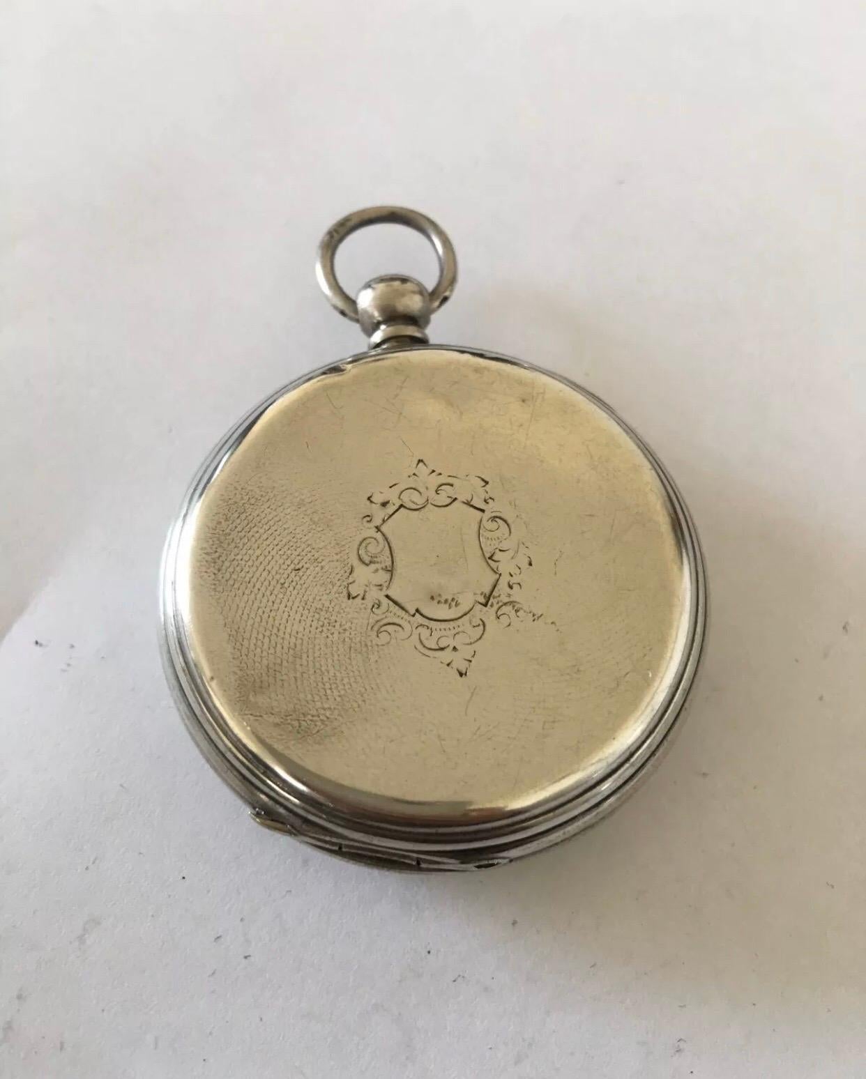 This beautiful antique silver pocket watch is working and ticking well. Visible dents on the silver case back cover as shown.

Please study the images carefully as form part of the description.