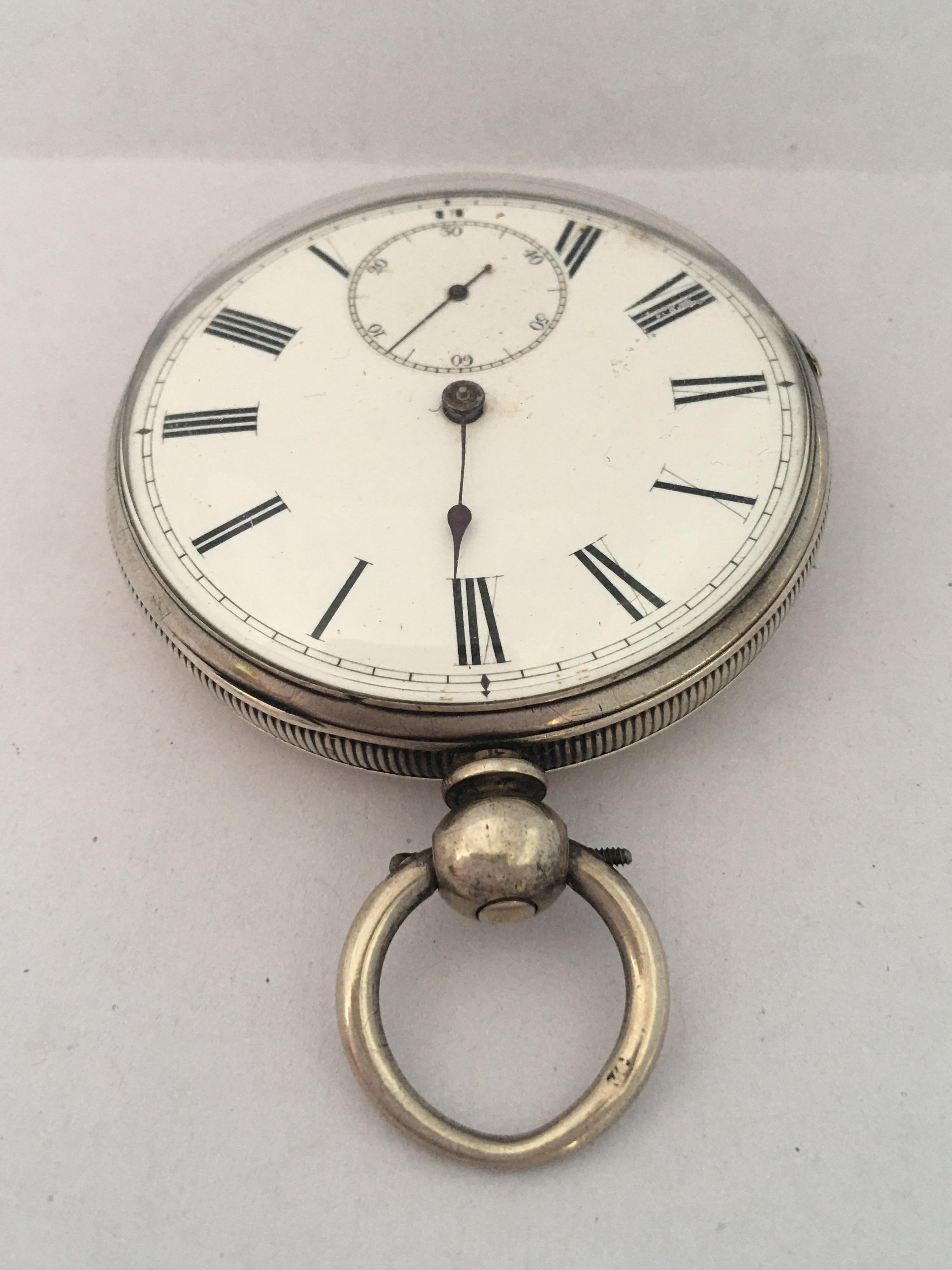This beautiful antique 51mm diameter key-winding silver pocket watch is in good working condition and it is running well. The minute hand is missing as shown. Visible signs of ageing and wear with light surface marks on the glass and on the watch
