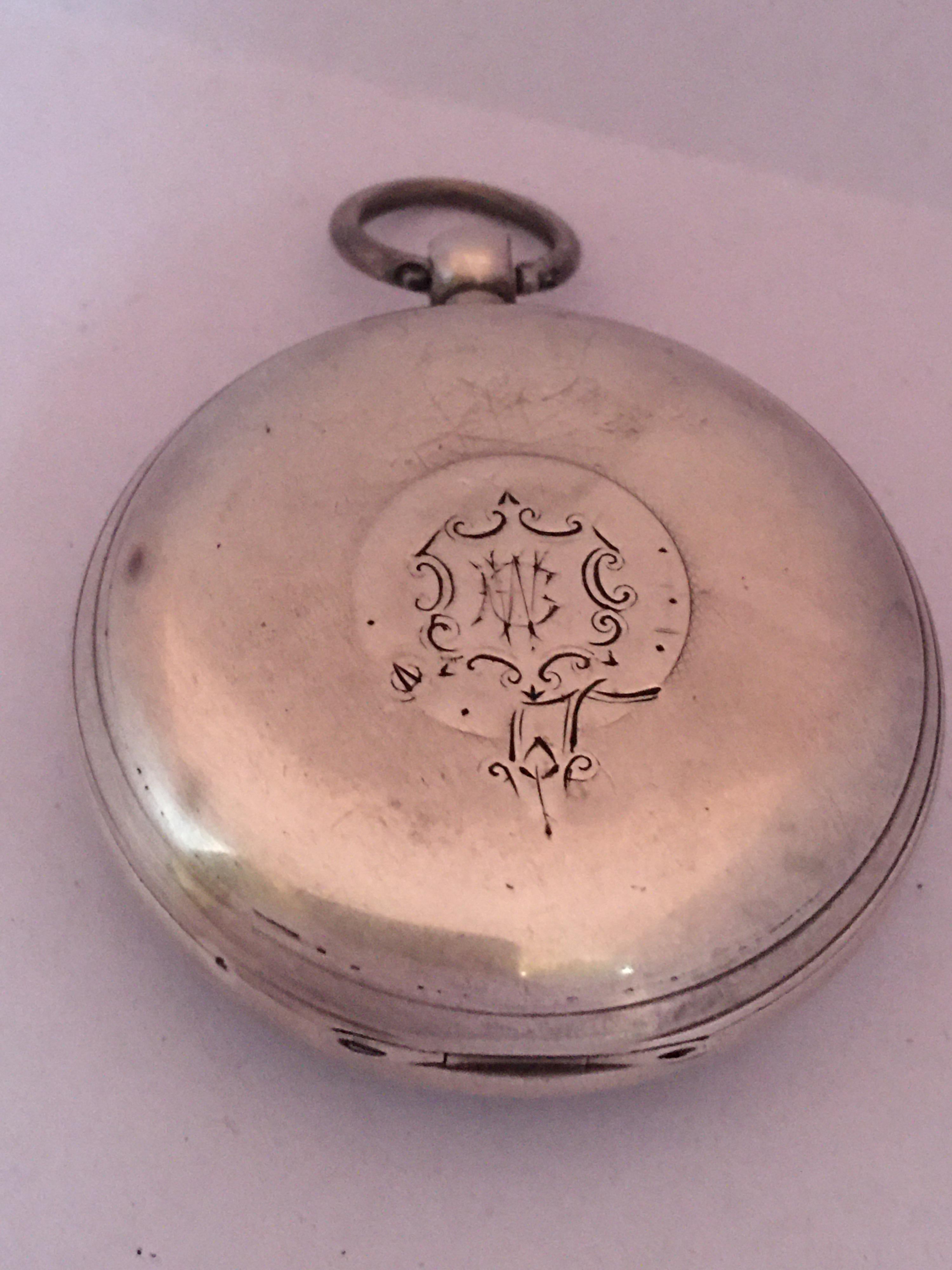 This beautiful antique key winding 52mm diameter silver pocket watch is in good working condition and it is running well. Visible signs of ageing and wear with light scratches on the glass and on the watch case as shown. Some tiny dents on the watch