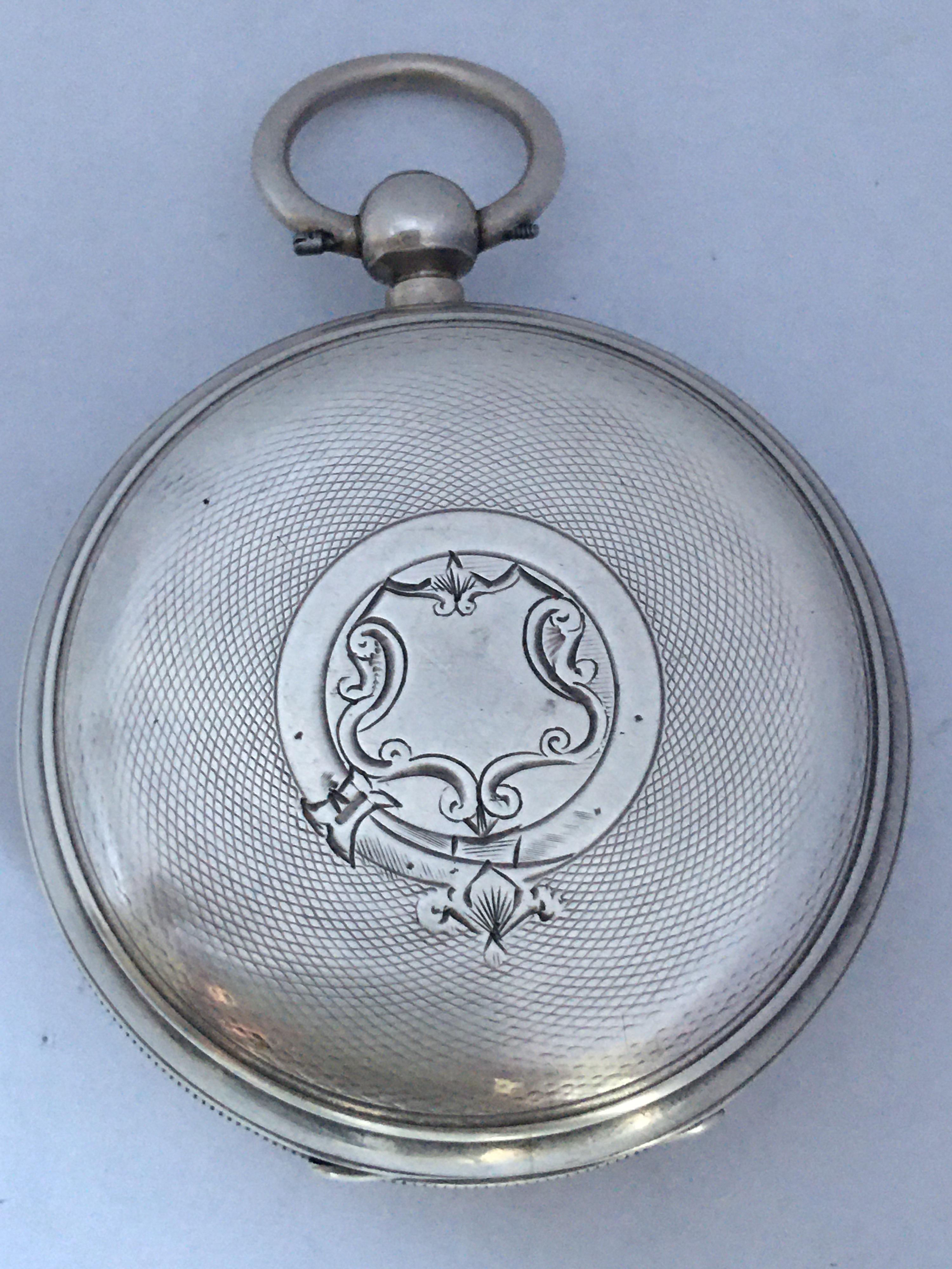 This beautiful pre-owned 51mm diameter antique silver pocket watch is in good working condition and it is running well. Visible signs of ageing and wear with light surface marks and tiny dents on the silver watch case and see marks on the glass