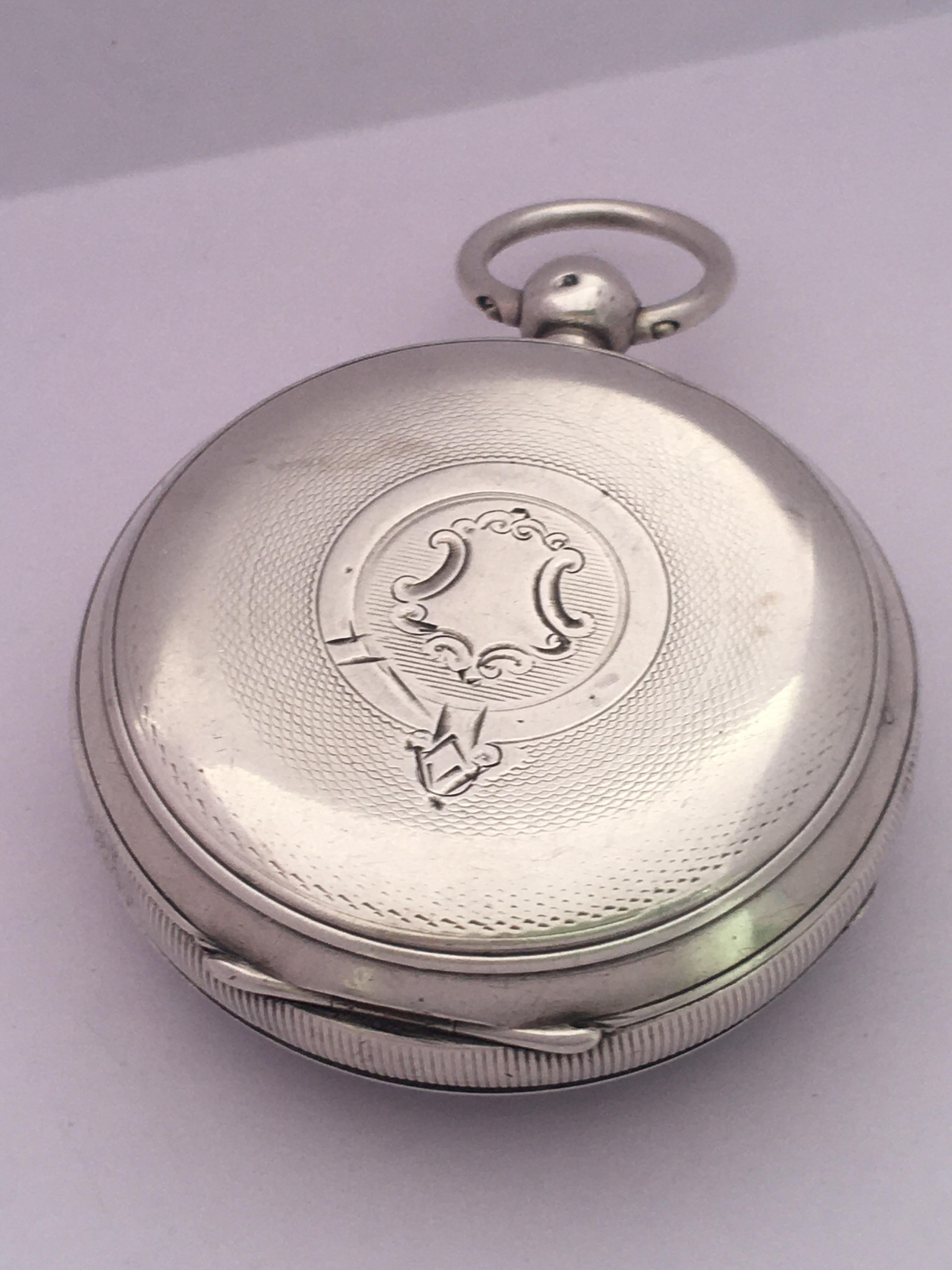 This beautiful antique 52mm diameter key winding silver pocket watch is in good working condition and it is ticking well. It is recently been serviced and it runs well. Visible signs of ageing and wear with light scratches on the glass and small