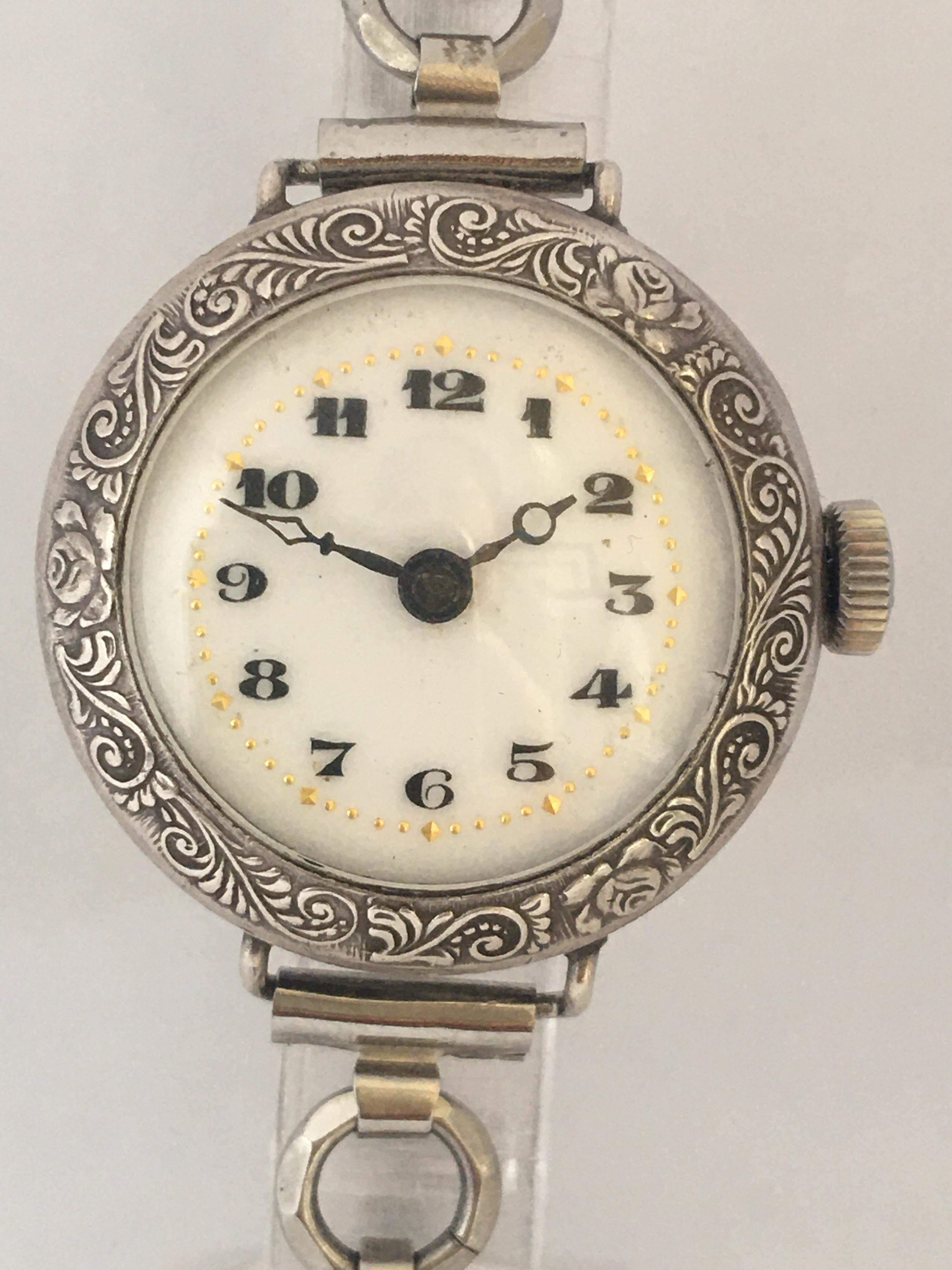 This beautiful pre-owner 26mm diameter silver hand-winding trench watch is in good working condition and it is ticking well. It is recently been serviced. Visible signs of ageing and wear with light and tiny scratches on the watch case. There’s is a