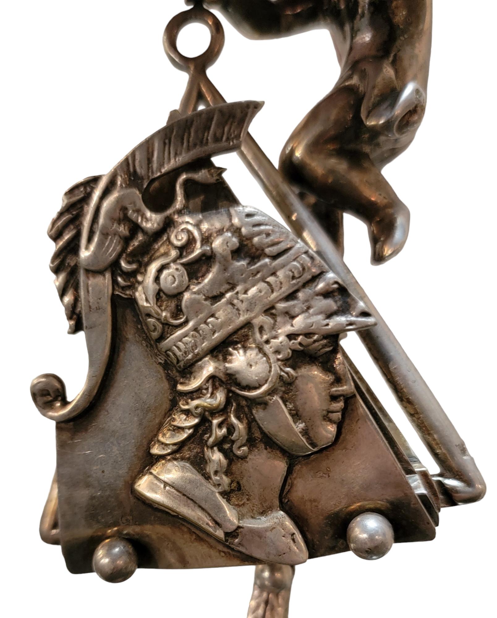 Antique Silver Letter Envelope Holder with baby figuring overlooking your mail.This wonderful Stand has a roman catolic soldiers head and halmet on the front. The base has an ornate design that blends into the stem. Meausres approx - 9.75h x 3.5w x