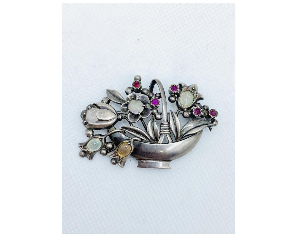 Antique Sterling Silver Moonstone and Ruby very High quality

CONDITION in great condition one of the opals looks to be replaced please photo

Some wear Consistent with age and use please see the photos for condition

Size is approximately 3 inches