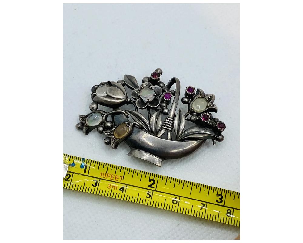 Antique Silver Moonstone and Ruby Flower Basket Brooch In Good Condition For Sale In New York, NY