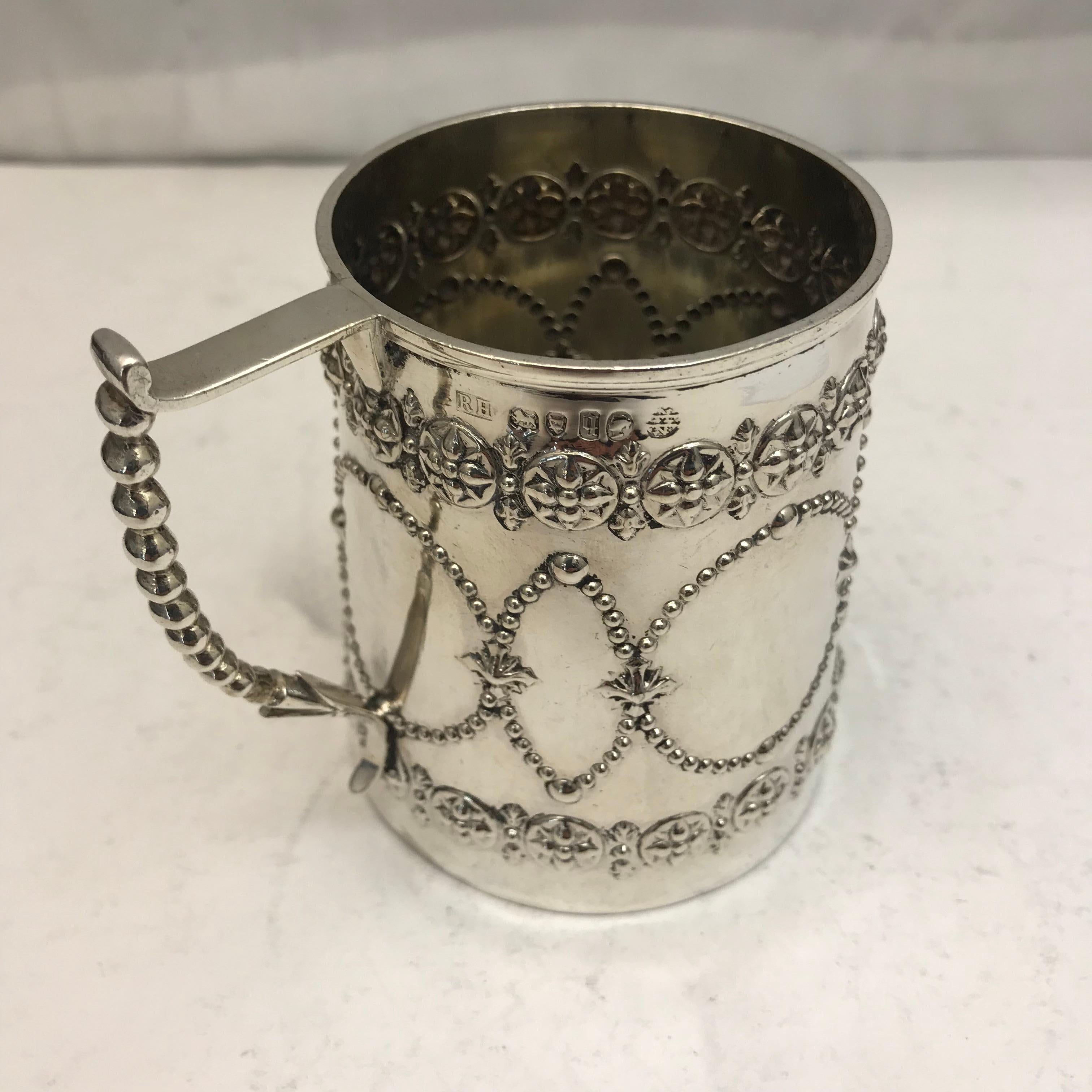 Small 19th century silver mug, decorated beautifully with a delicate handle.
 