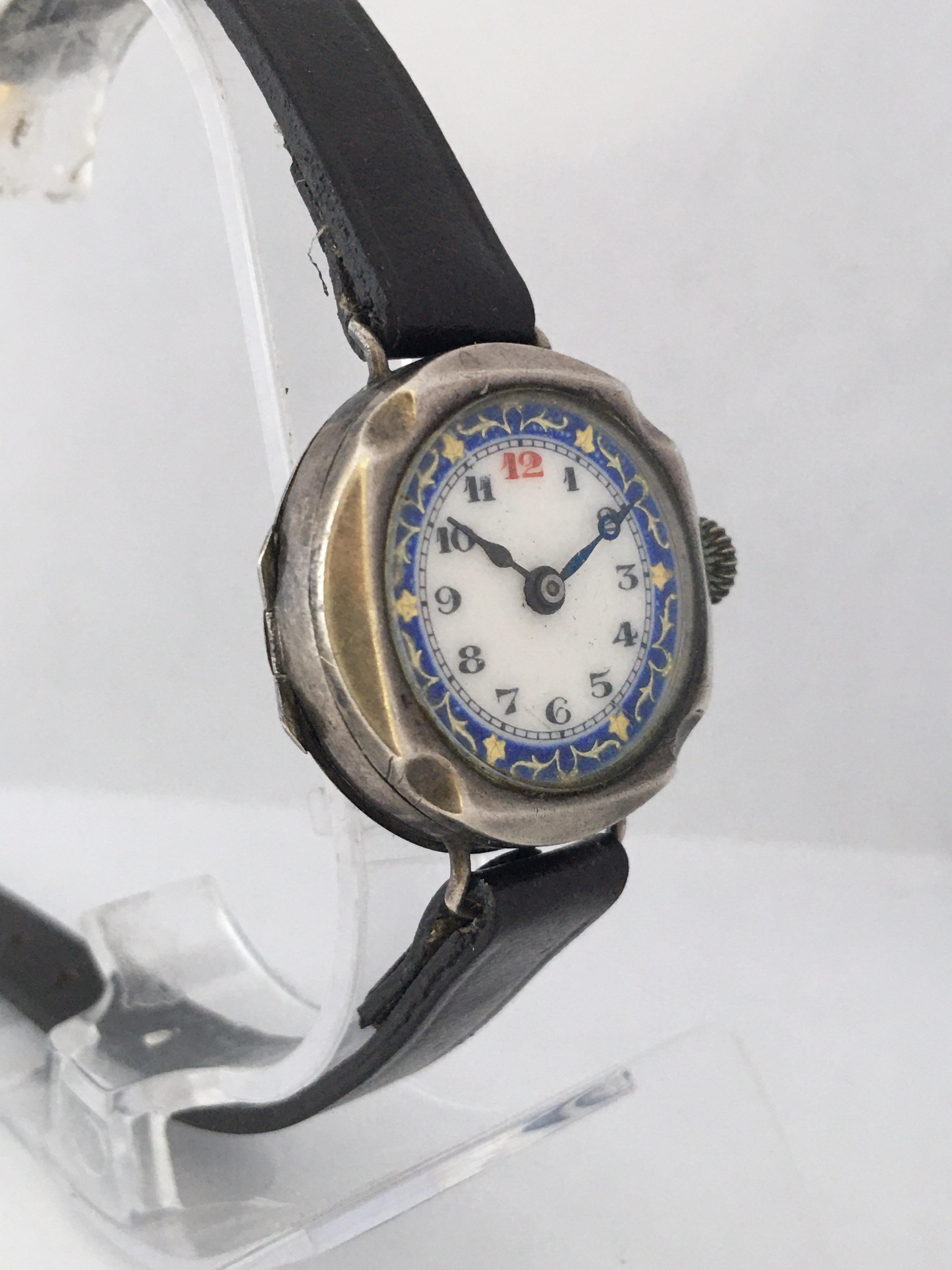 This small and beautiful hand winding ladies trench watch is in good working condition and it is running well. It is recently been serviced. Visible signs of ageing and wear with small and light scratches and dents on the silver watch case and it