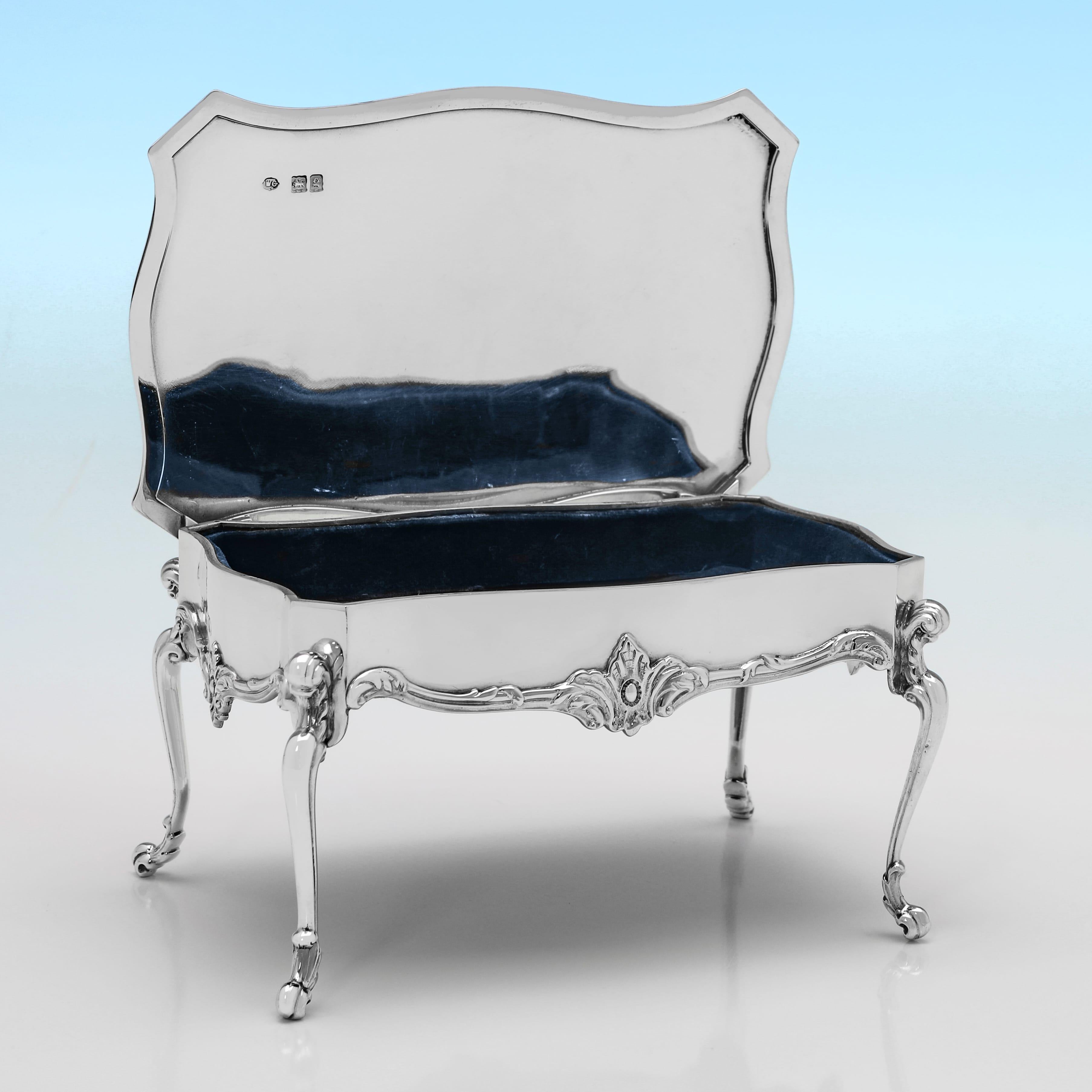 Hallmarked in London in 1902 by William Comyns, this attractive, Antique, Edwardian Sterling Silver Jewellery Box, is modelled as a side table with cabriole legs, and features a blue fabric lined interior. The jewellery box measures 3.25