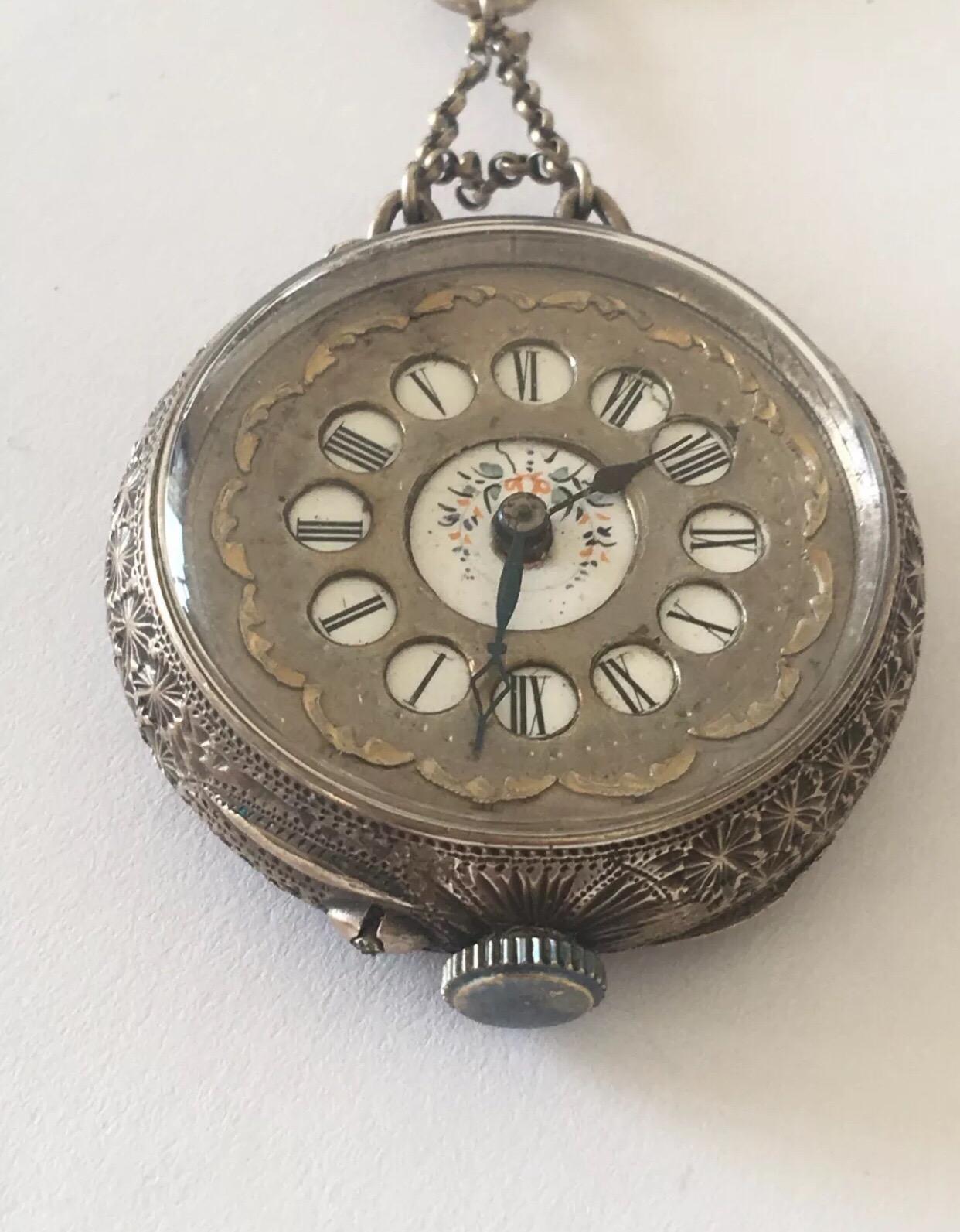 This beautiful ball dial antique silver nurses fob watch is in good working order.