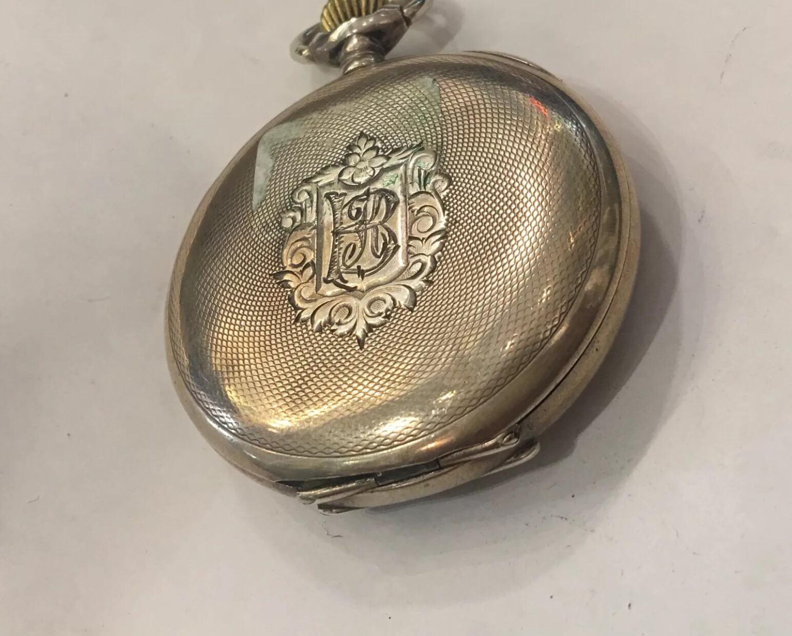 
Antique Silver Omega Pocket Watch.


This watch is in good working order.

The back cover hinges is broken but the back cover s does still close