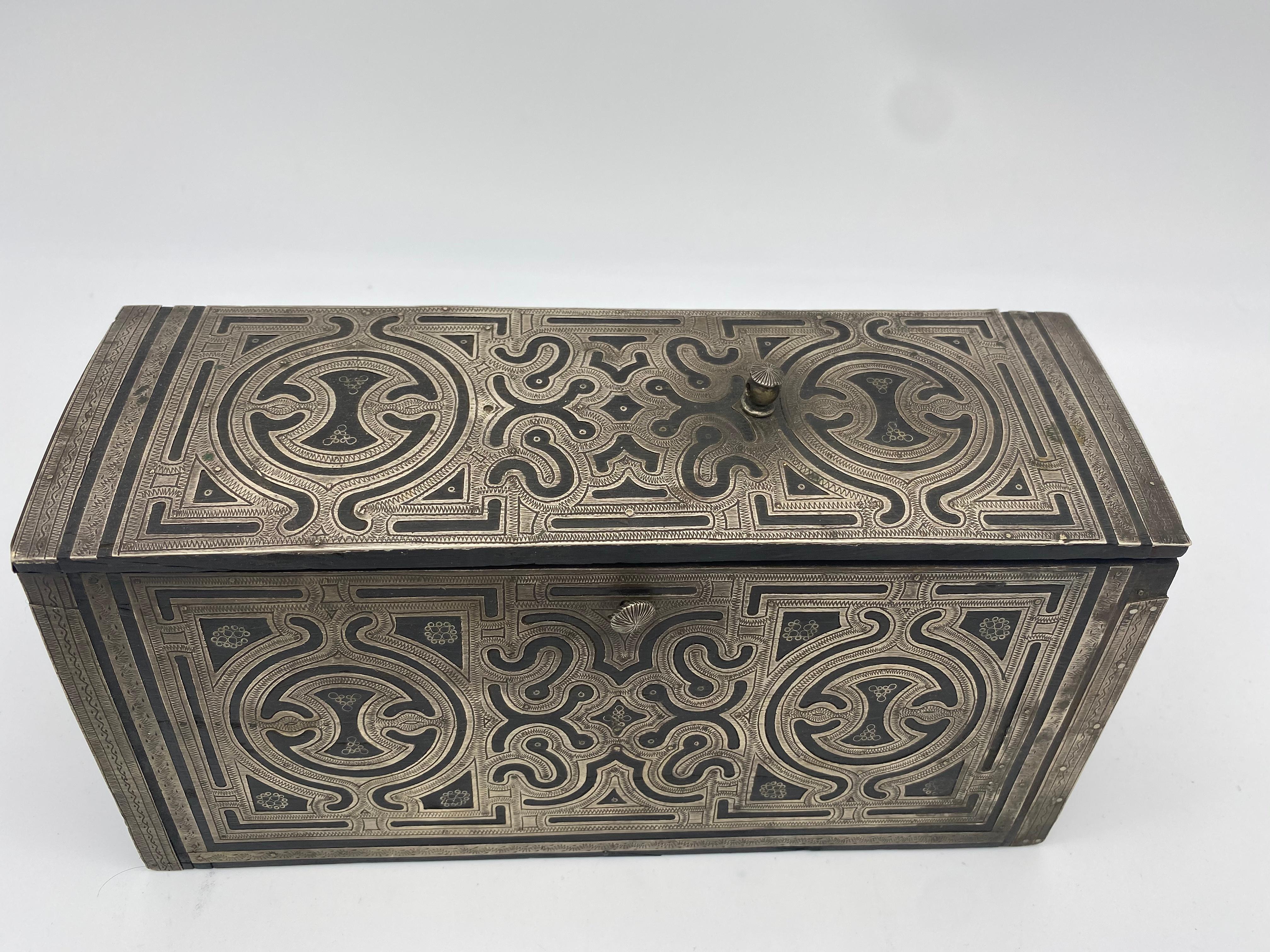 Antique silver outer layer on wood box. Extremely beautiful and very hard to find with intricate geometrical designs. Top of box width is 3 in. Bottom of box width is 4.5 in. See image.