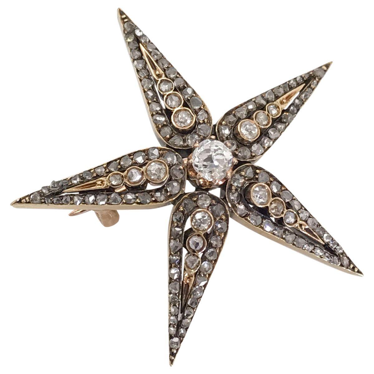 Some people might see a star in this brooch, some might see a starfish or even a snowflake but regardless of what you see it's beautiful. An original antique brooch with a combination of old cut and rose cut diamonds. It is fashioned from silver