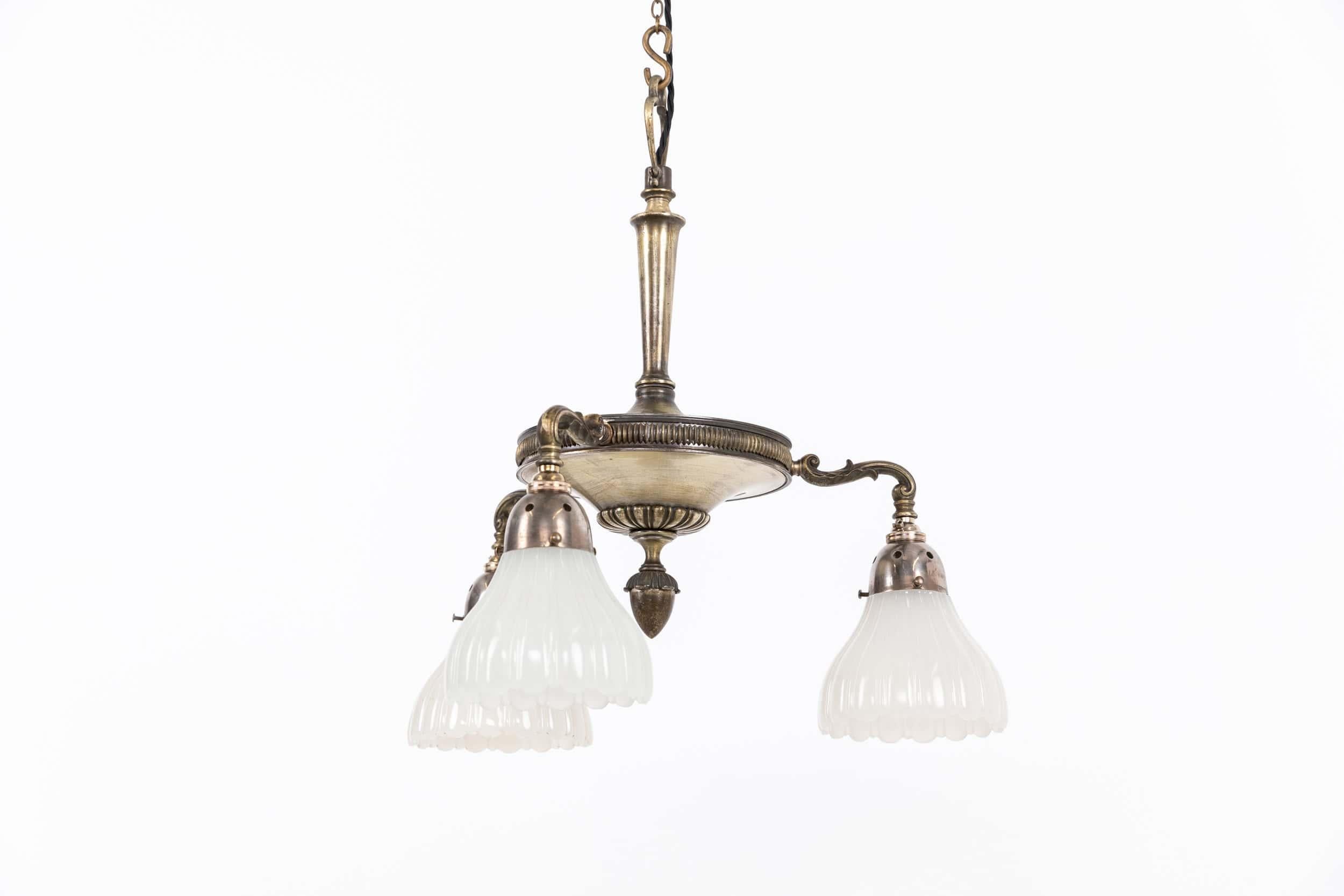 

An incredibly elegant electrolier made in England by GEC - General Electric Company. c.1920

Heavy brass construction of a very high quality with original - and beautifully tarnished - silver plated finish.  Complete with it's three perimeter