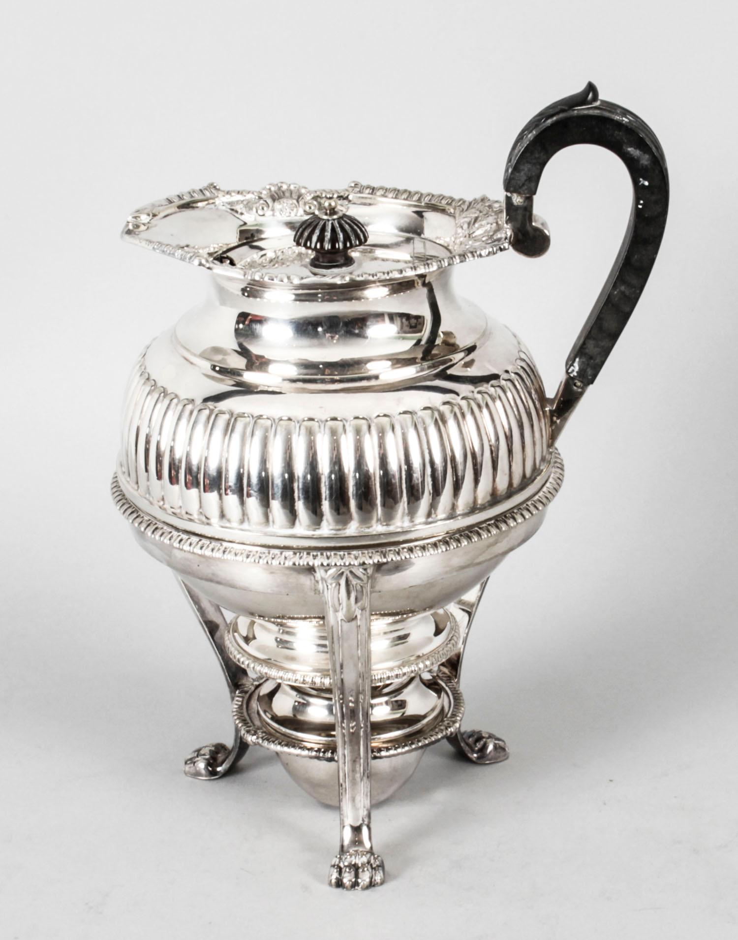 This is a stylish English antique silver plated Coffee biggin on Stand by the renowned silversmith Elkington & Co, circa 1860 in date.

This superb kettle has a circular shaped body with an elegant handle and gadrooned decoration.
 
It has