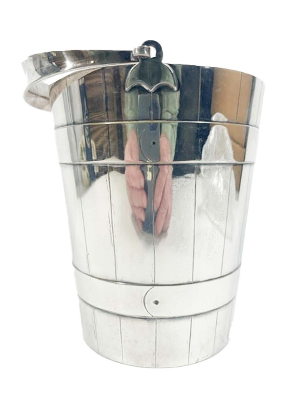 Edwardian silver plate ice bucket and tongs. The bucket with a bail handle and interior strainer is modeled to resemble a staved and banded pail, the tongs have acanthus leaves and bird talons at the ends.