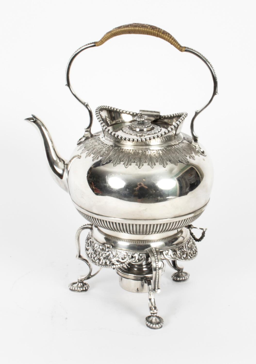 This is a stylish English antique silver plated spirit kettle on stand by the renowned silversmith Elkington & Co with the date mark for 1845.

This superb kettle has a circular shaped body with an elegant handle and a Louis spout.
 
It has a