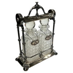 Antique Silver Plate Tantalus with Scotch and Rye Cut Glass Decanters
