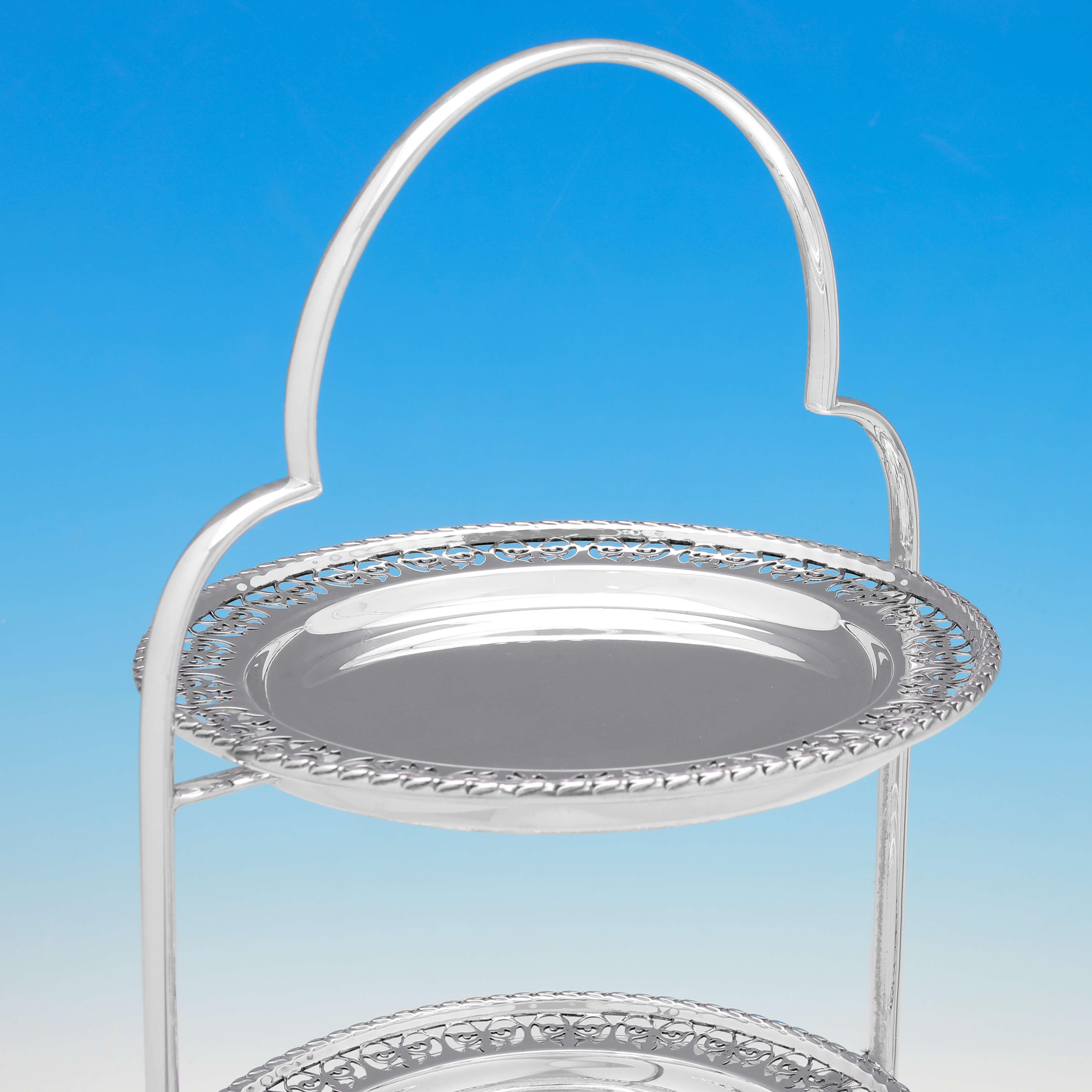 Made circa 1910 by Gladwin Ltd., this attractive, antique silver plate cake stand, has 3 tiers, and features a plain stand, and a pierced border to the plates. The cake stand measures 16.75